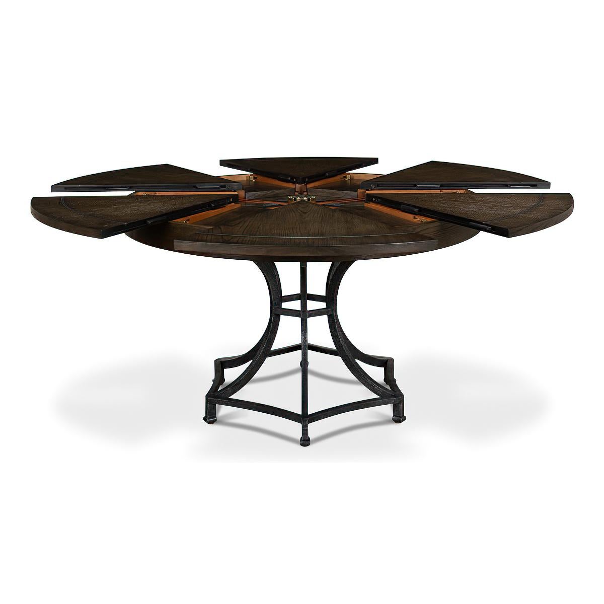 A Modern Industrial style round extending dining table. Featuring a dark brown finish oak top with dark hammered metal inlays on a metal pedestal column base.

Open dimensions: 70