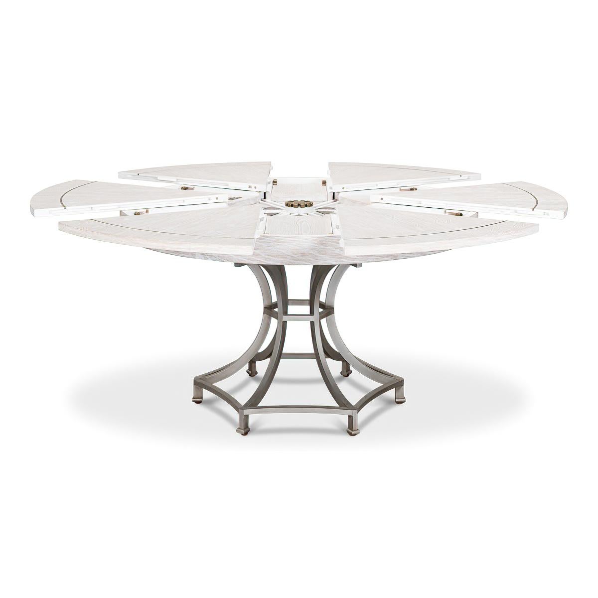 A Modern Industrial style round extending dining table. Featuring a modern white wash finish top with gunmetal inlays on a metal pedestal column base.

Open dimensions: 70