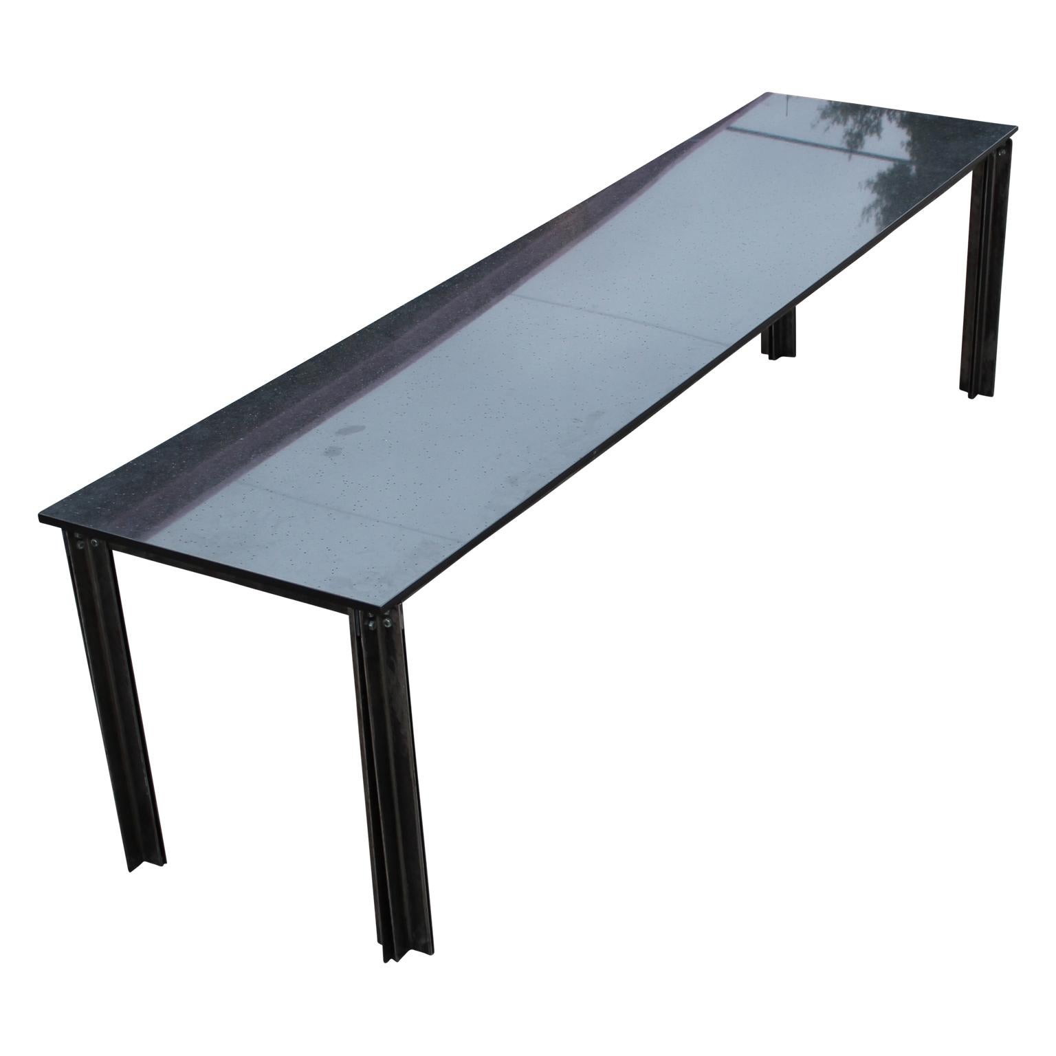 Lovely modern industrial steel and granite top conference or dining table, circa 2000s.