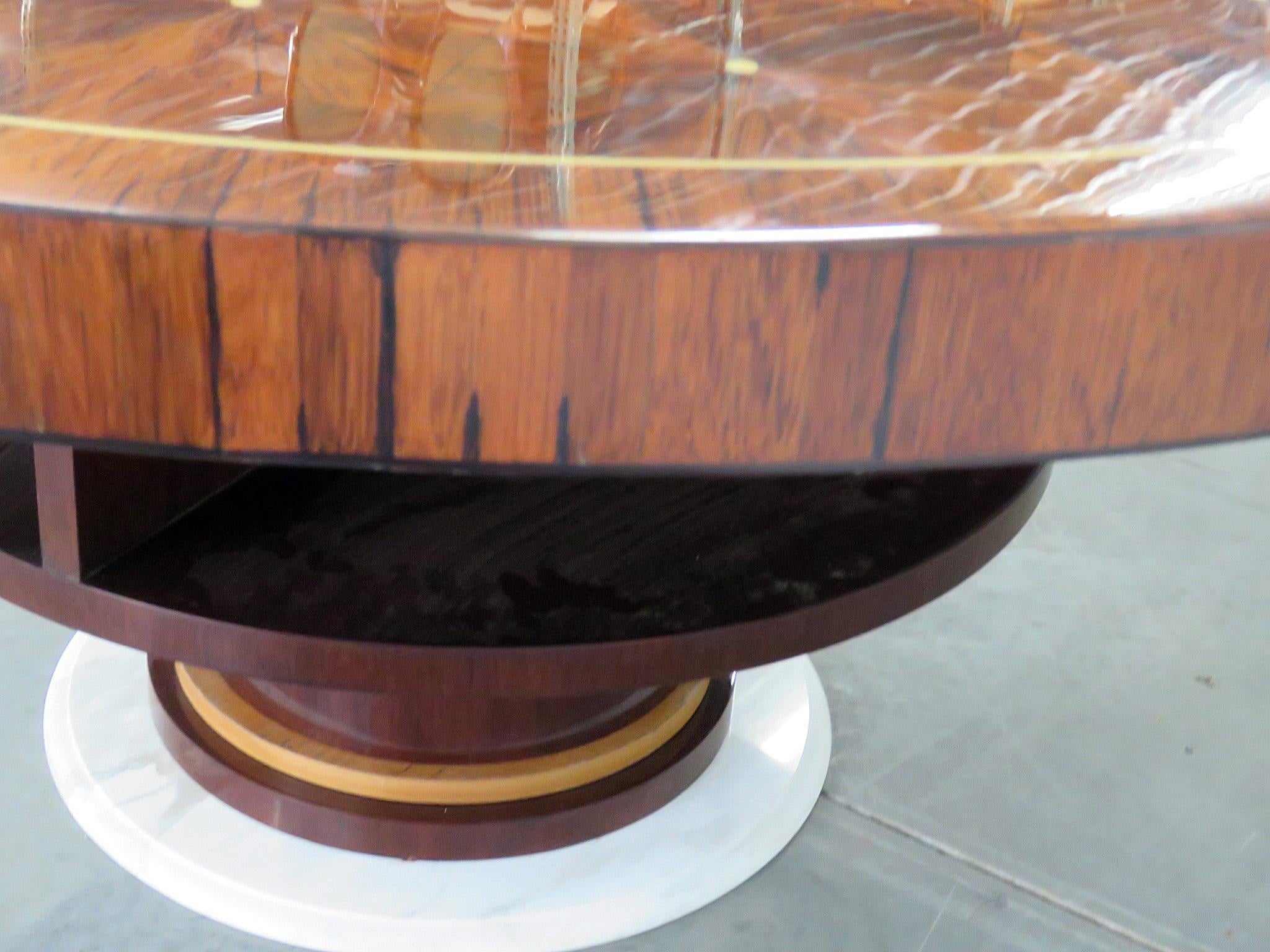 Rosewod Art Deco inlaid dining table with 4 shelves underneath and a marble base.