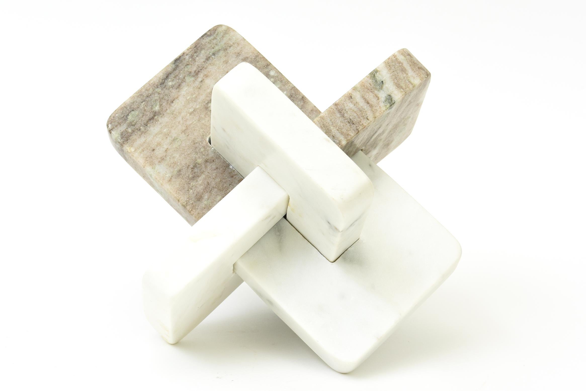 This substantial modern contemporary marble sculpture has intersecting planes of different varieties of marble that all coexist. From every angle it is different. Heavy and fabulous. The colors of the marble range from off white to tan, beige,
