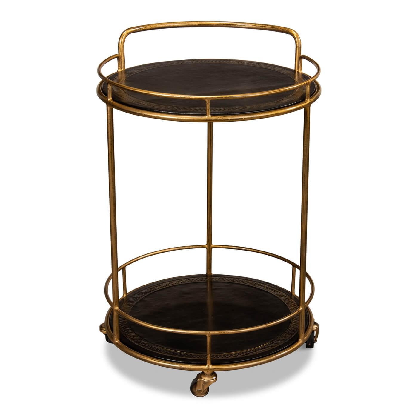 Modern iron and leather serving side table and cart. This smaller two-tiered round serving cart sits on gold casters and is accented with hand-antiqued and tooled leather-covered shelves. Timeless striking color combinations in elegant gold and