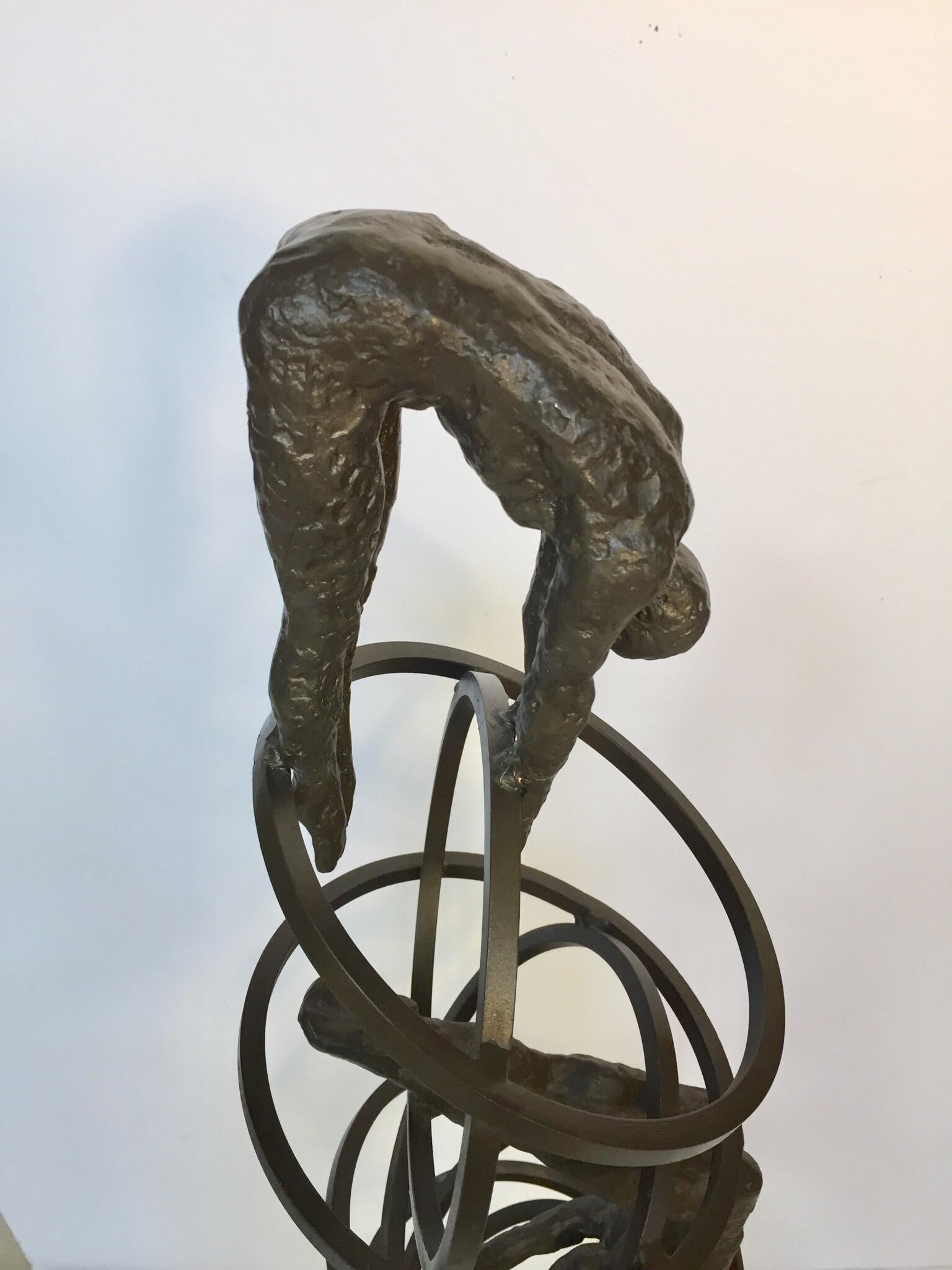Vintage Modern cast iron Brutalist style sculpture of divers on rings sculpture on marble stand.
Captured in mid-dive in cast iron, these handsome divers sculpture pay homage to the fluid precision of a professional diver.
Measures: 12 inch x by 8