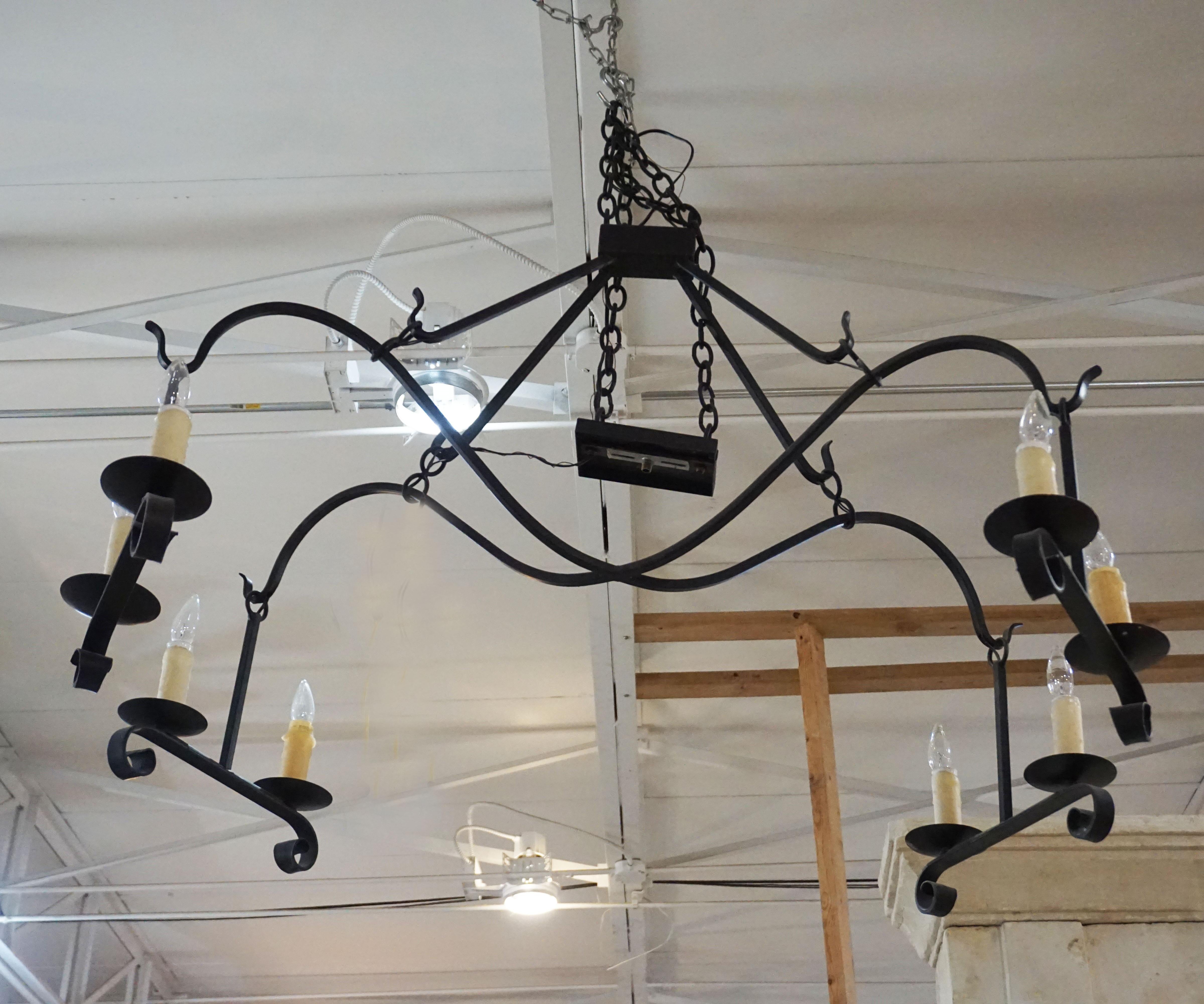 This contemporary chandelier features nice curves and minimalist design.

Measurements: 35'' H x 48'' L x 32'' W