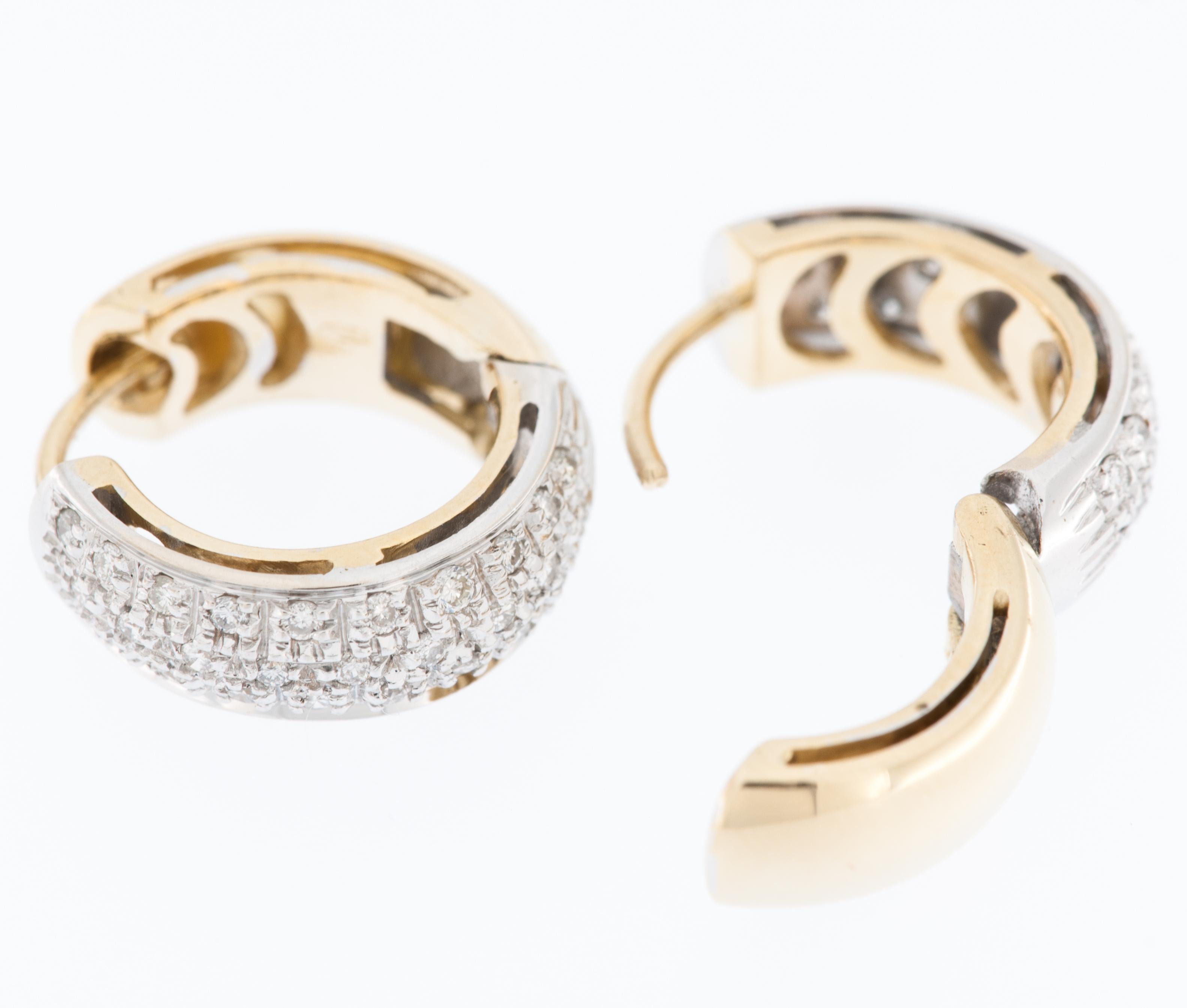 The Modern Italian 18kt Gold Hoop Earrings described are a sophisticated and elegant piece of jewelry, blending classic hoop design with luxurious materials and intricate details. 

Crafted from 18-karat gold, these earrings boast a high level of