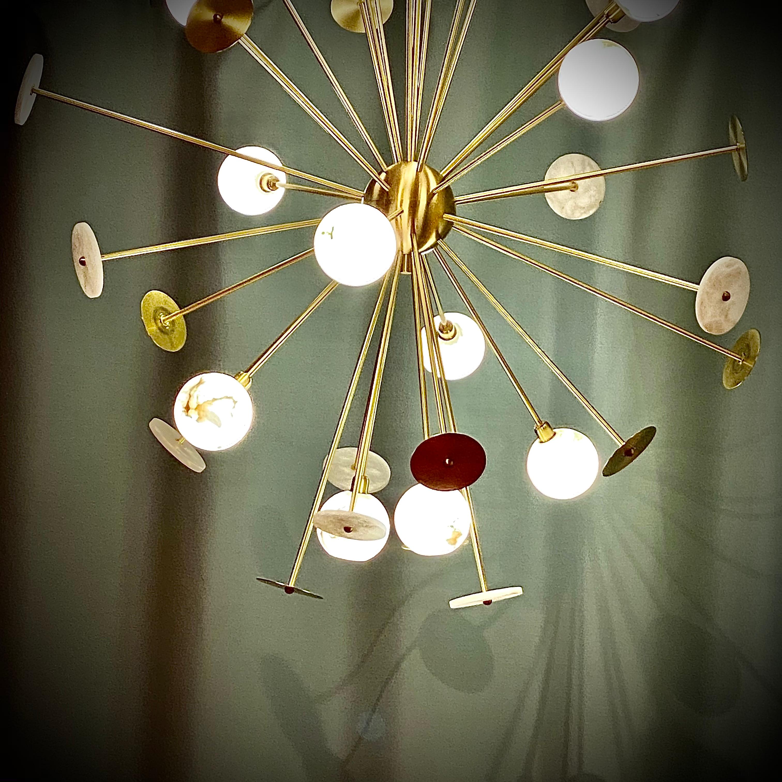 Cosulich Interiors & Antiques in collaboration with Matlight - Milan: this bespoke sputnik chandelier, entirely handcrafted in Italy, is an explosion of light and reflections, pleasing the eye with flat and round shapes as well as by the use of