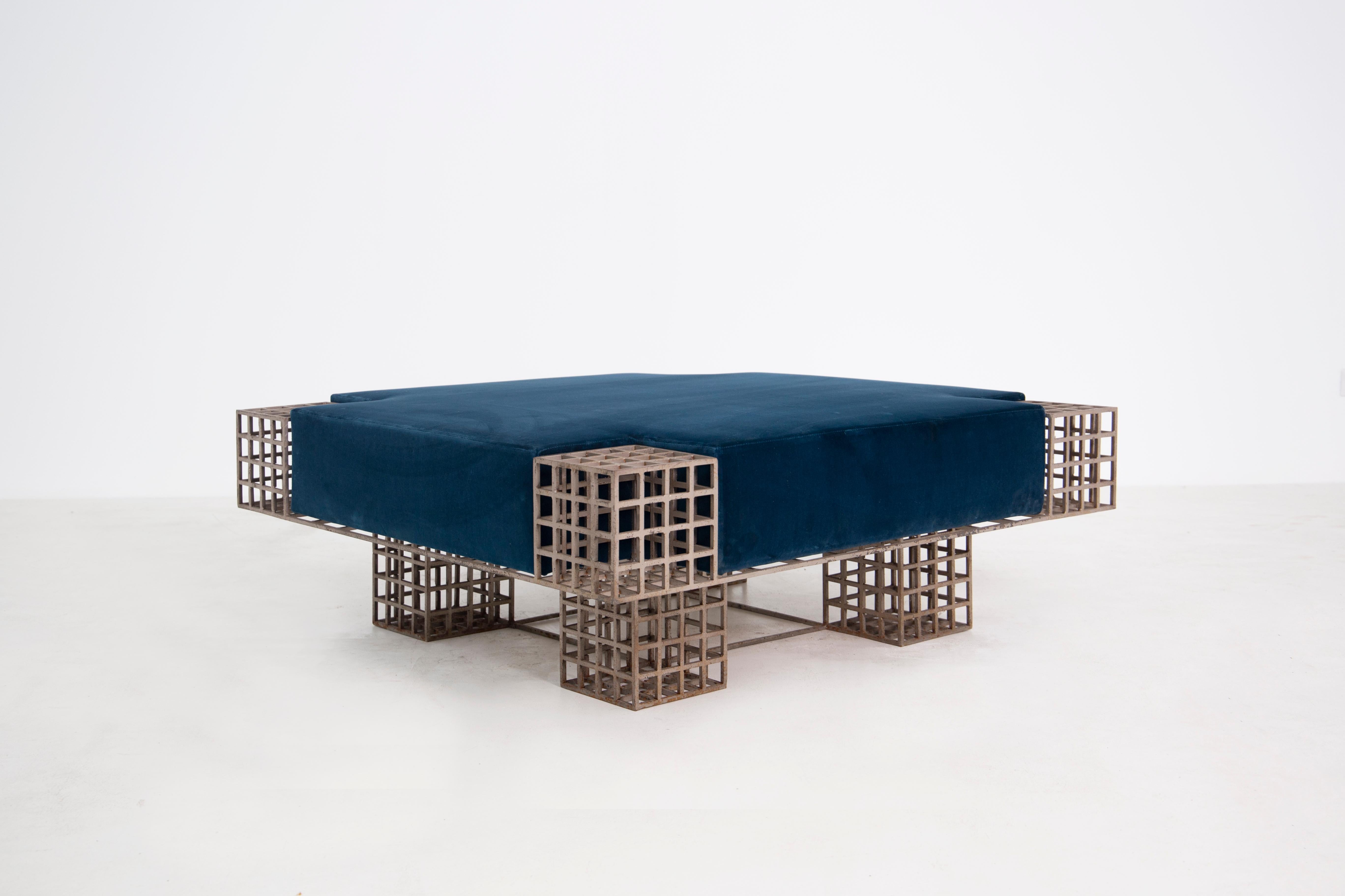 Sculptural square center bench designed by the famous Italian gallerist and publisher Carla Sozzani. The bench is from 1970. Its metal structure made with modular design creates a perfect symmetry with the module and sculpture. The bench seems to