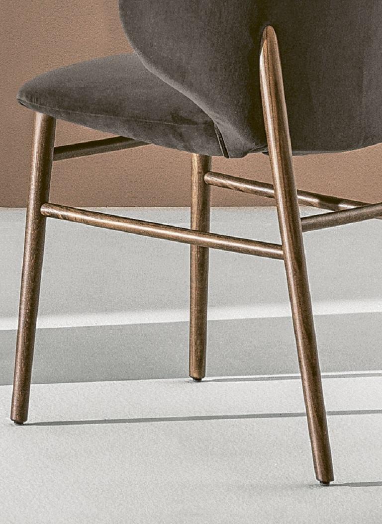Designed by Pocci&Dondoli, the Drop chair has folds on the back making it a masterpiece of tailor-making, it gives you the feel of a hug when you are sitting on it. Drop is absolute comfort in an indisputable design. The frame is in Walnut solid