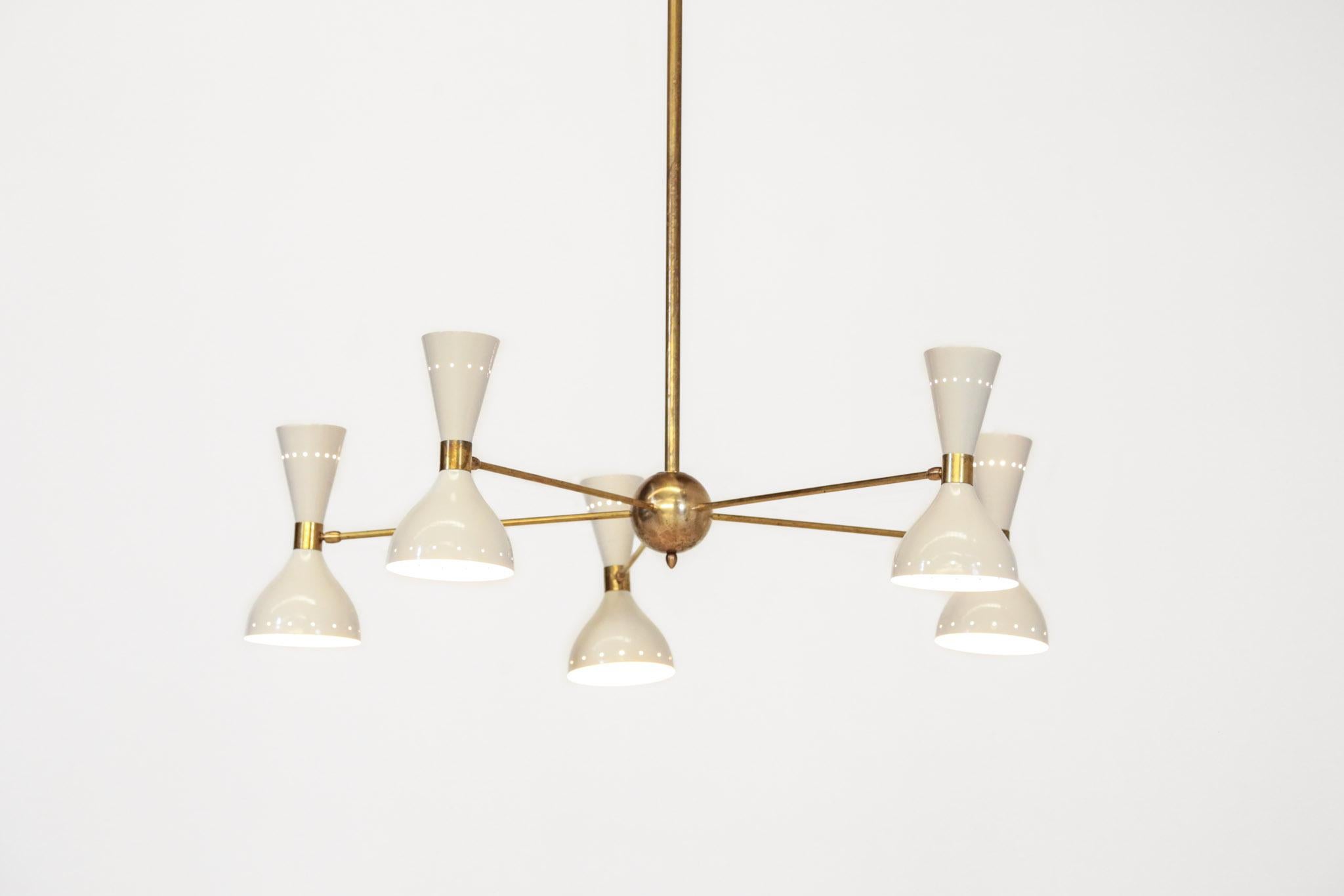 Beautiful modern chandelier Stilnovo style, structure in brass with metal lampshades.
 