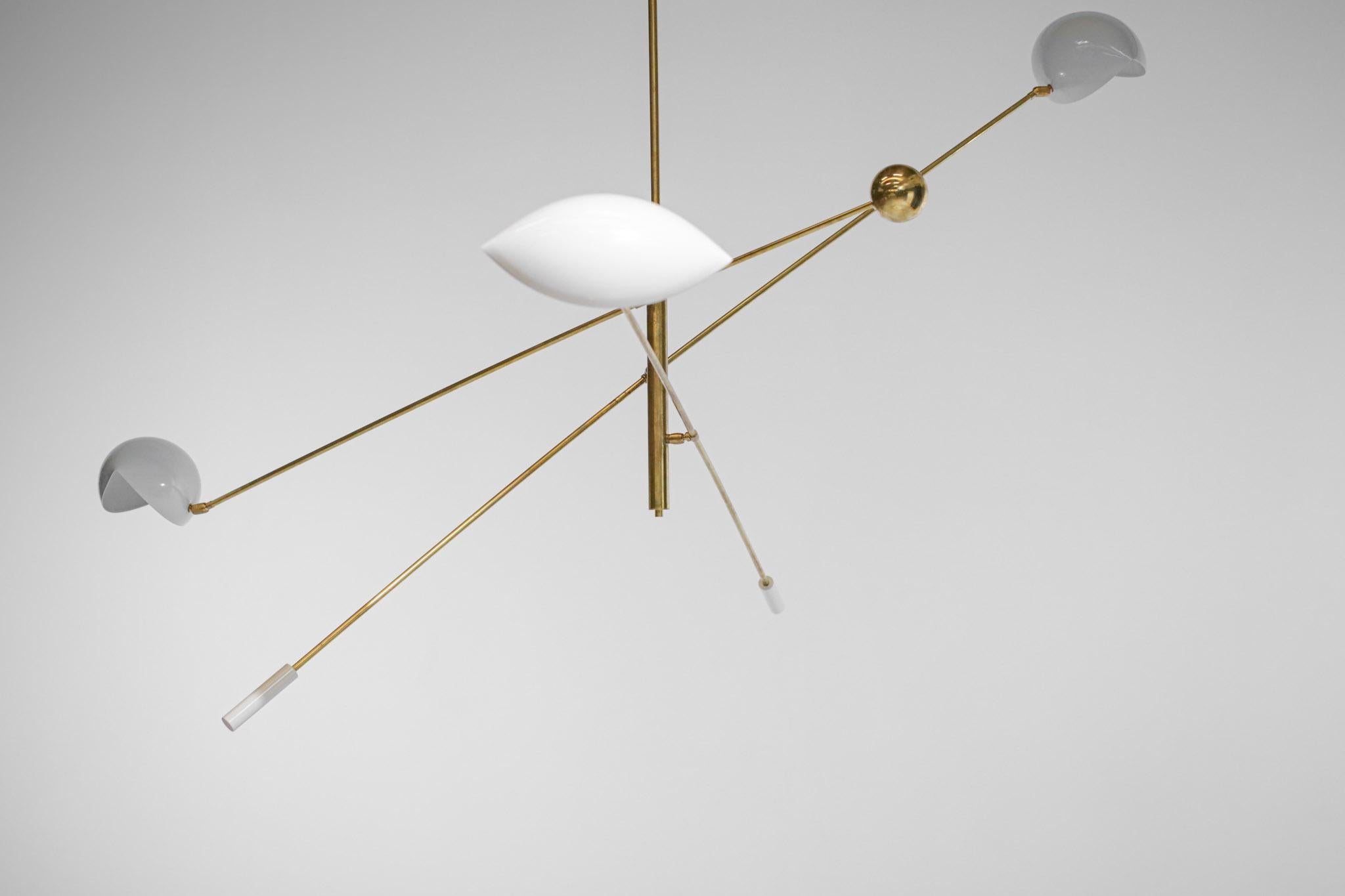 Modern chandelier with pendulum and counterweight, made in style of the Stilnovo publishing house by our Italian craftsman. Structure in solid brass, lampshade and counterweights in off-white lacquered metal that can be adjusted according to your