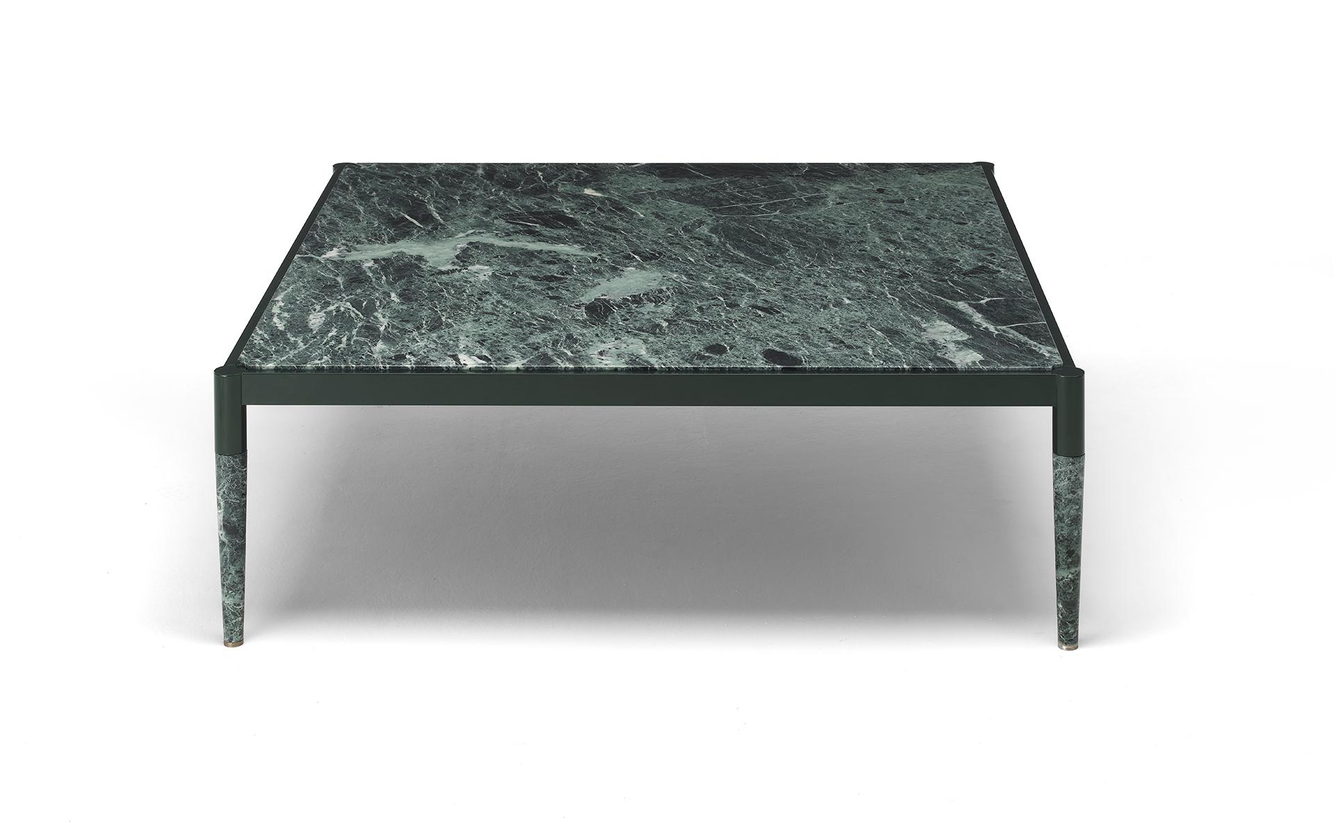 In the Bic coffee table a central aluminum frame supports the top and holds the legs, both made of marble. The resulting visual effect is that of a solid stone piece held tight by a minimalist and geometric metal crown. The marble of the top, with