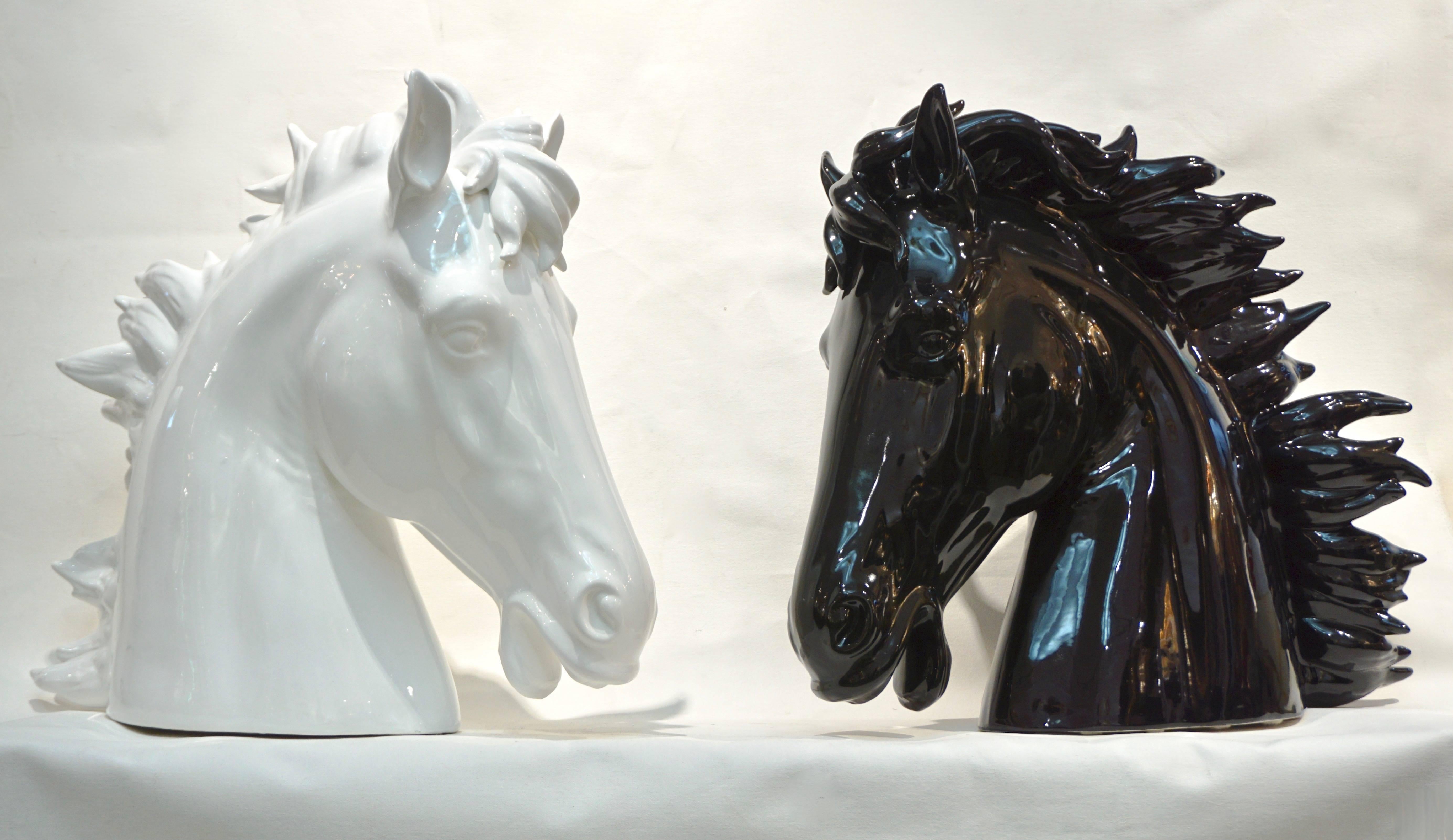 Highly decorative modern pair of grand size ceramic stallion heads, made in Italy. Realistic representation with flowing ruffled mane, the black and white colors highlighted by the quality glaze finish.

 