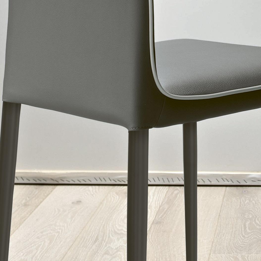 Designed by Bontempi Casa, Nata chair combines comfort and simple lines. Its frame is in Anthracite lacquered metal, which is obtained folding and manufacturing the raw material to acquire the desired design. It is then painted with electrostatic