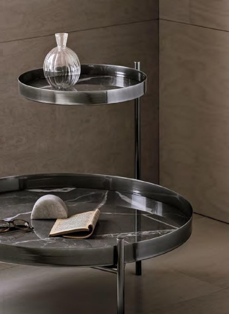 Designed by Solido Studio, this retrò inspiration coffee table is suitable for day and night environments. It is enriched by a moltitude of finishes and inserts in precious metals with chromatic combinations for any living space. The Planet coffee