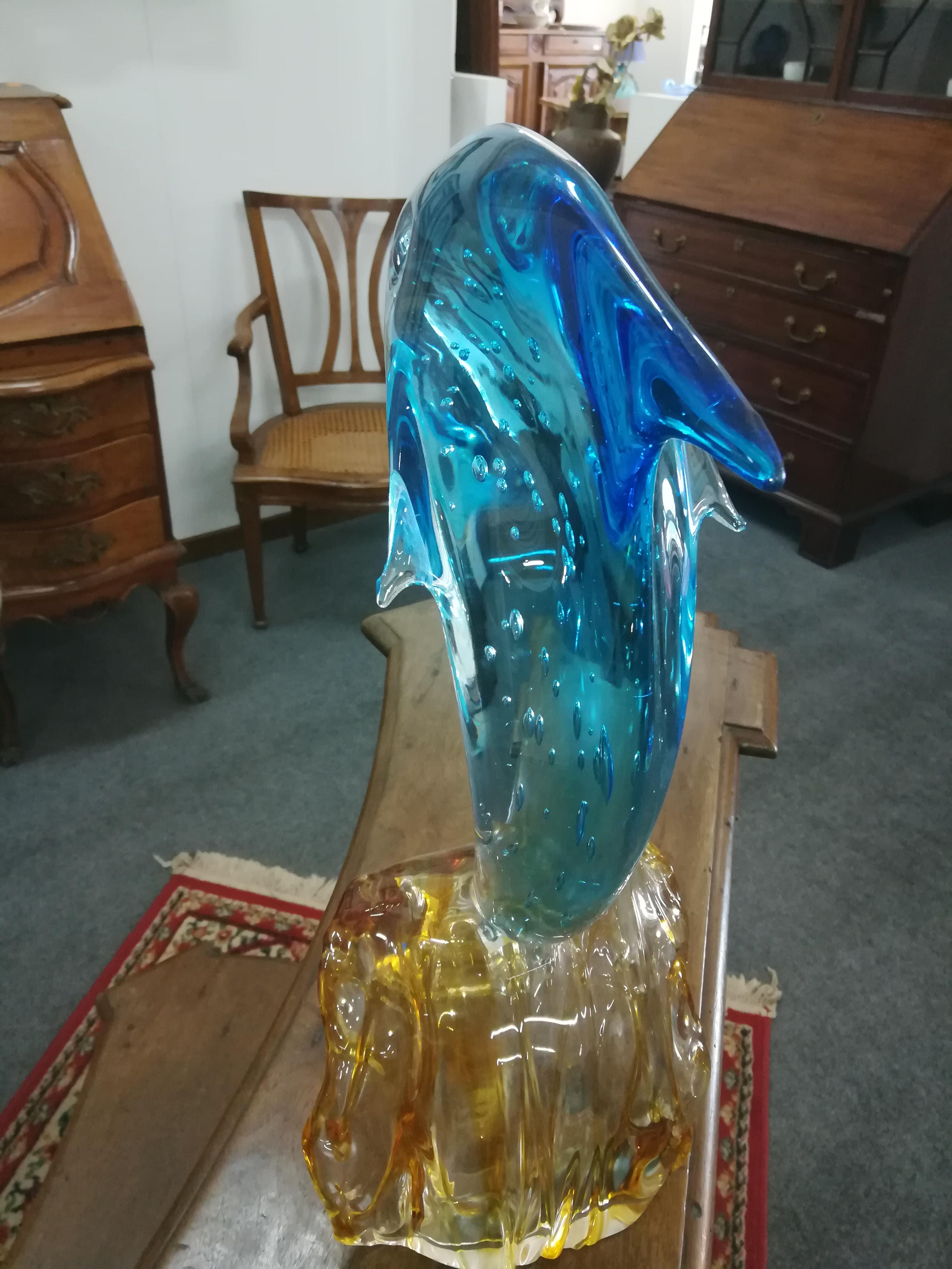 This is a Italian light blue glass dolphin sculpture made by the glass maker Sergio Costantini.
It remember the beauty of the ocean it is full of little bubbles inside made by the master blowing inside a special instrument.