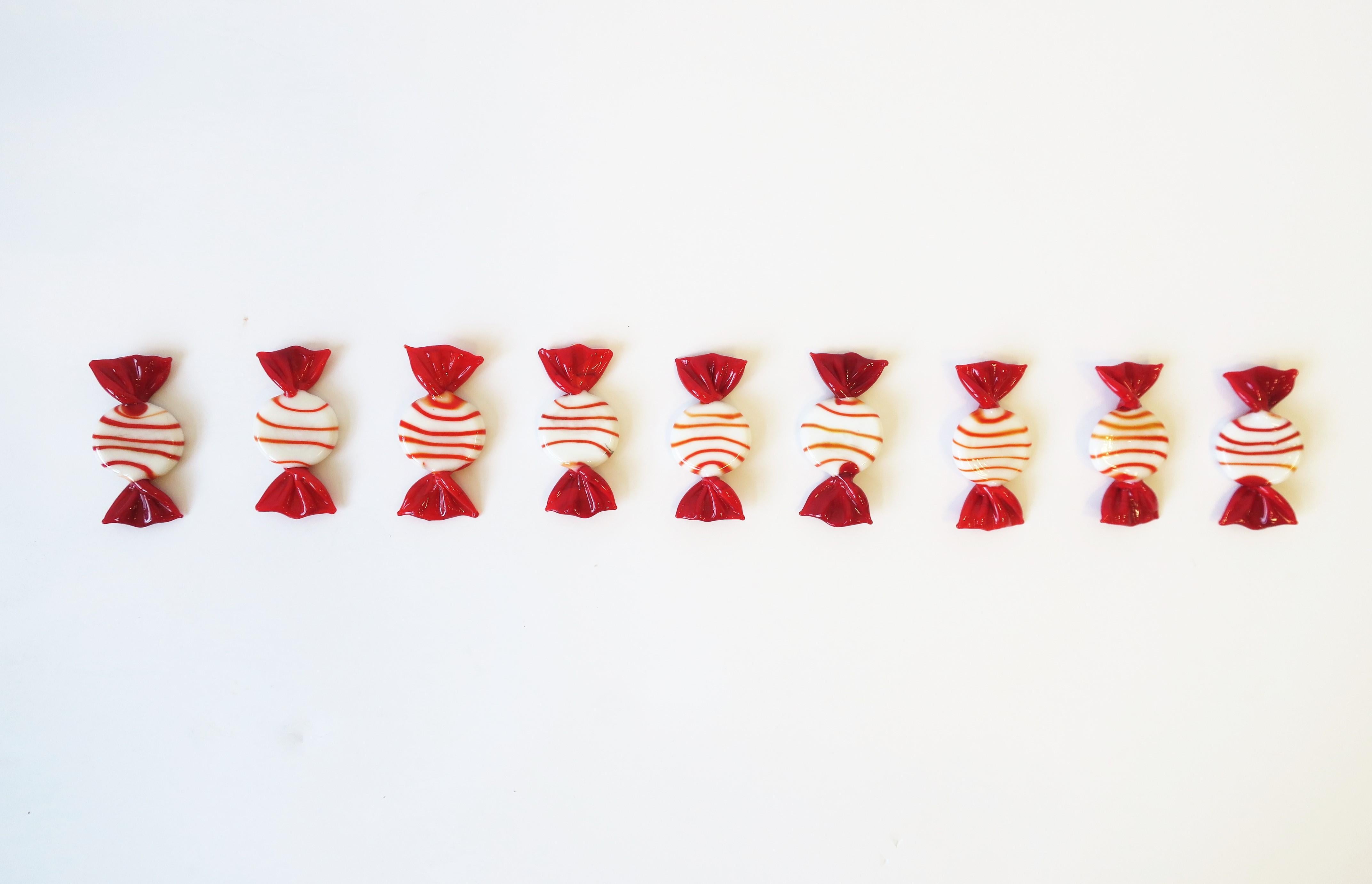 A beautiful set of 12 hand blown Italian Murano art glass red and white candy pieces, circa 20th century, Italy. 
Each measure: 1