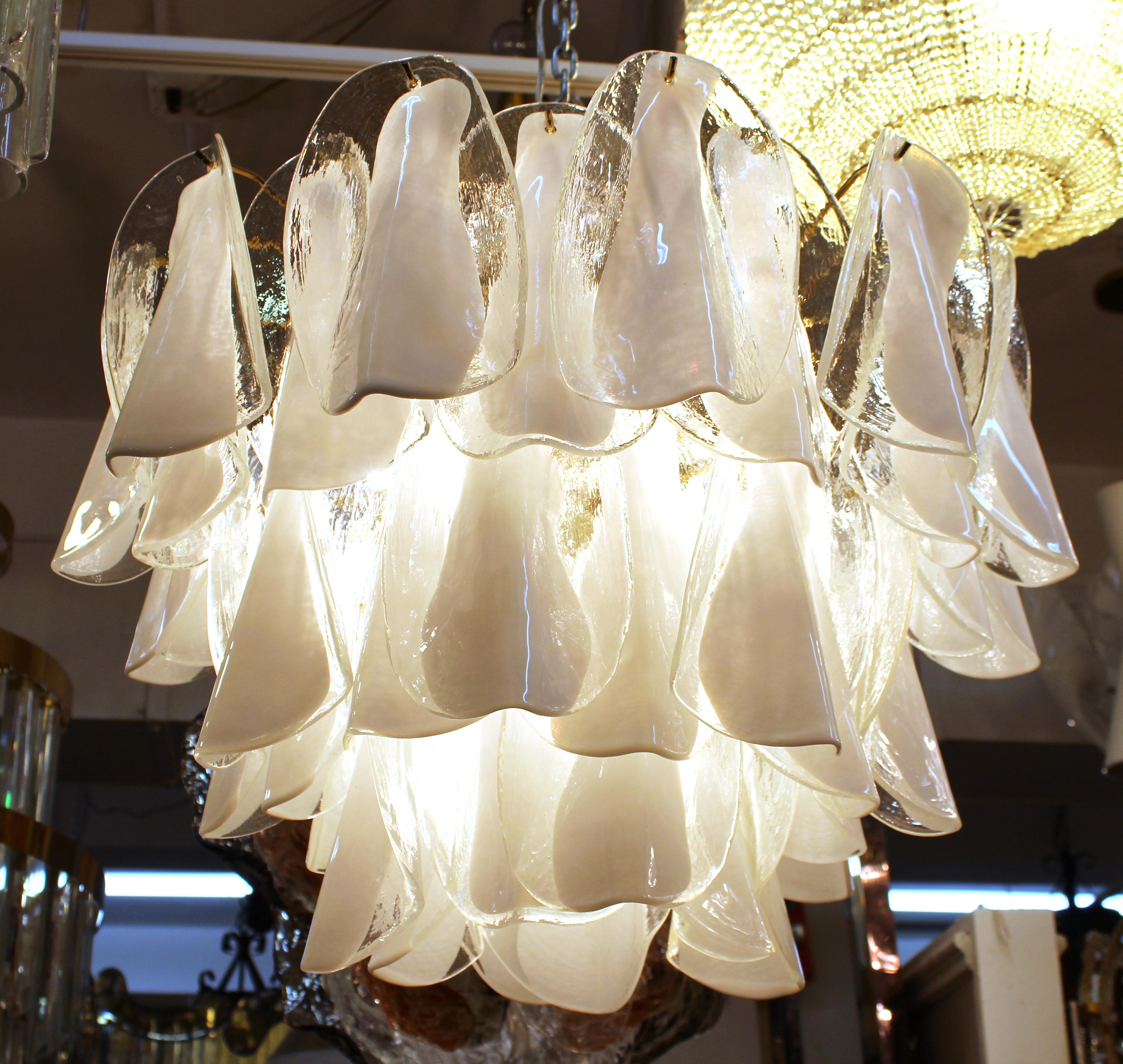 Modern Italian Murano glass chandelier with three tiers of semi-folded glass leaflets in white and clear glass. The piece is great vintage condition and has recently been rewired.