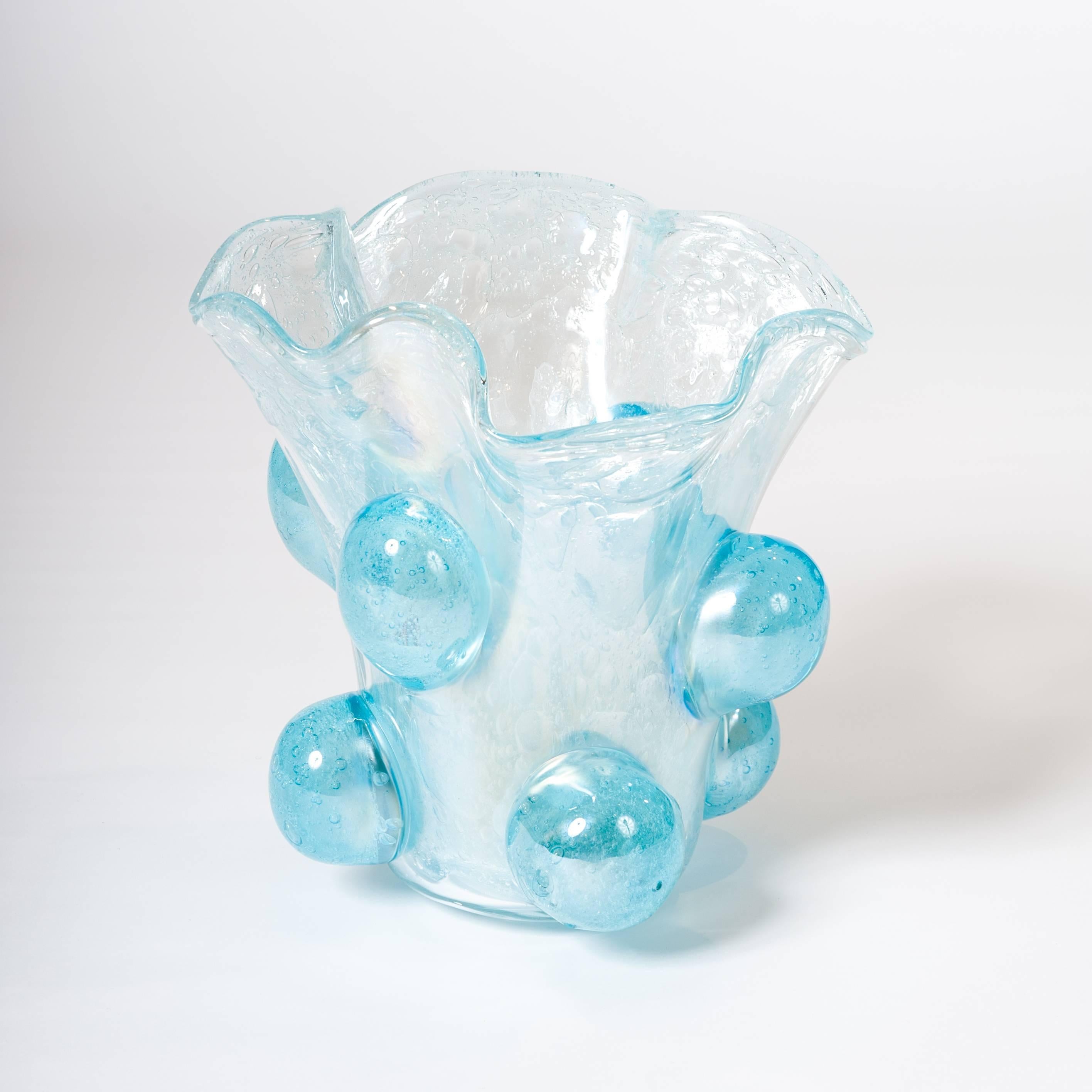 Modern Italian Murano glass vase turquoise colored with surreal impression.
The wavy shaped orifice, the small different air bubbles inside the glass body and the enormous glass bubbles outside on the surface turn into a sculpture.
The fantastic