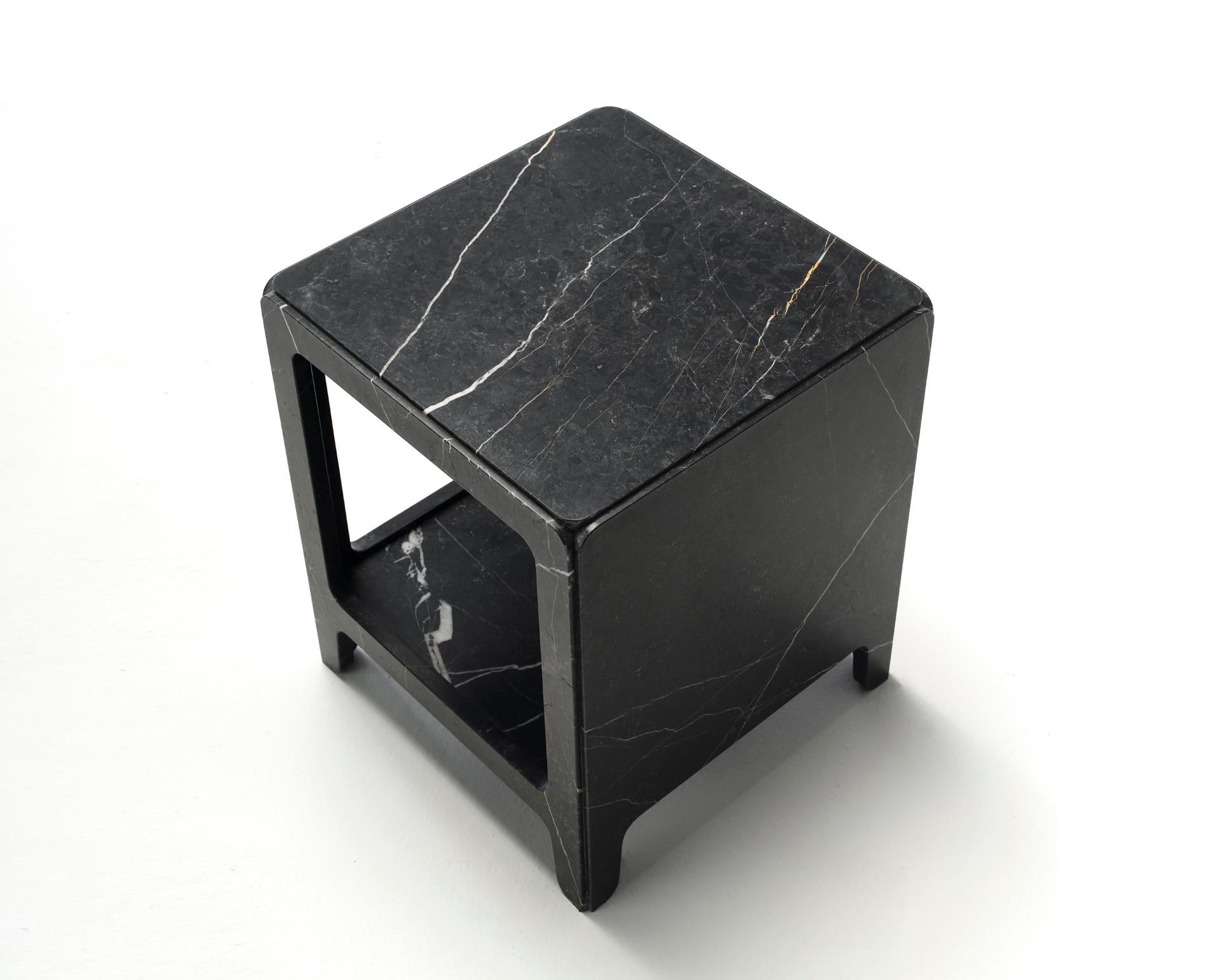 Rock, a night stand completely made of marble, was designed by Alberto Colzani and produced by Epònimo in Milano. Through a simple trick the piece, which is in fact the assembly of five parts, appears sculpted from a solid block. Rock can be
