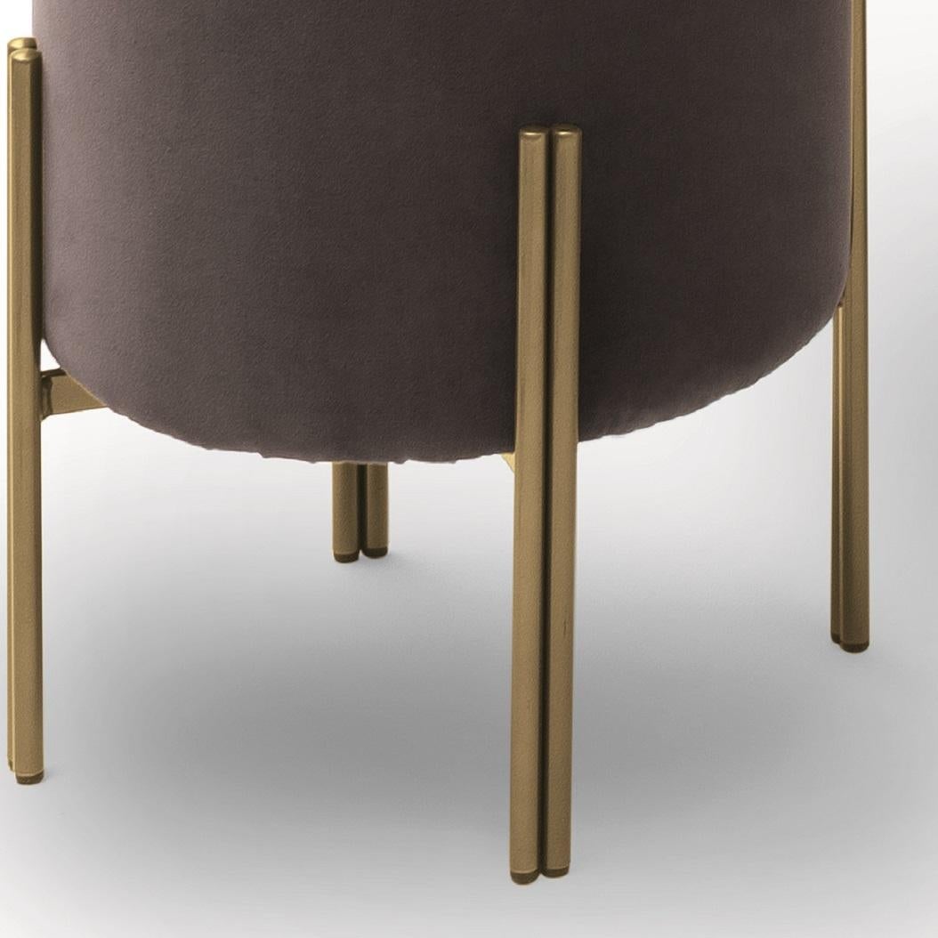 Designed by Bernhardt&Vella, Puffoso is an ottoman that combines style and function, its soft and ergonomic shapes make it perfect as seat, footrest or as simple decorative element. Its frame is in Aged Brass lacquered metal, which is one of the