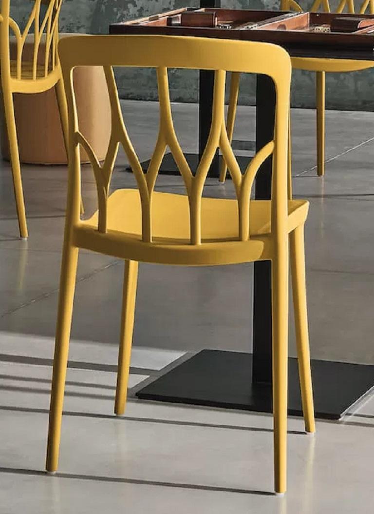 This yellow Mustard Polypropylene chair is Stackable and suitable for indoor and outdoor use. Designed by Pocci&Dondoli, Galaxy is aesthetics, strength and functionality. The graphic decoration of the back gives the seat a lively and stylish soul.