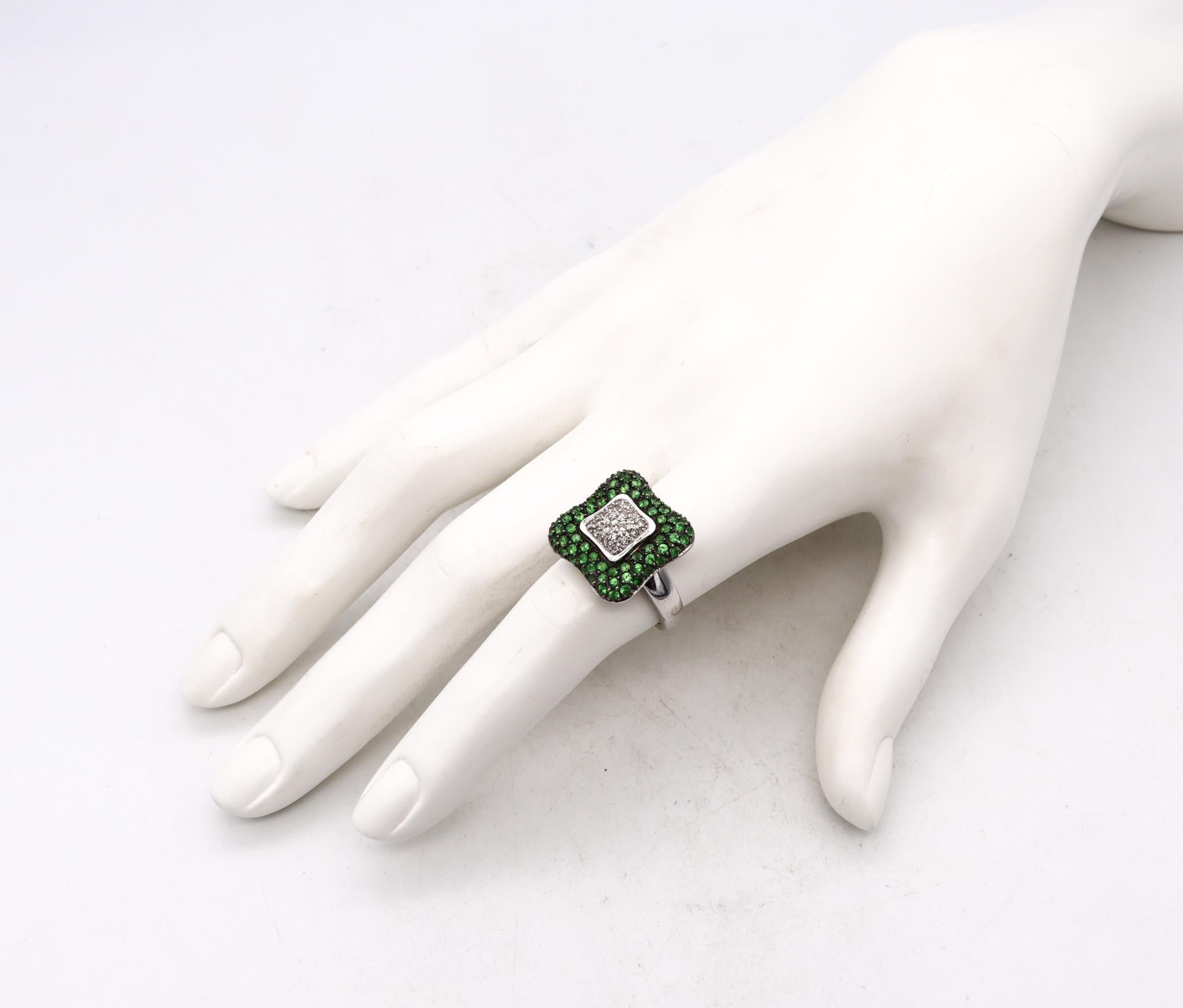 Square shaped jeweled cocktail ring.

Modern and colorful piece, crafted in Italy in solid white gold of 18 karats. All surfaces are highly polished.

Mount on top, with a pave setting of very fine natural gemstones. The center part is set, with 21