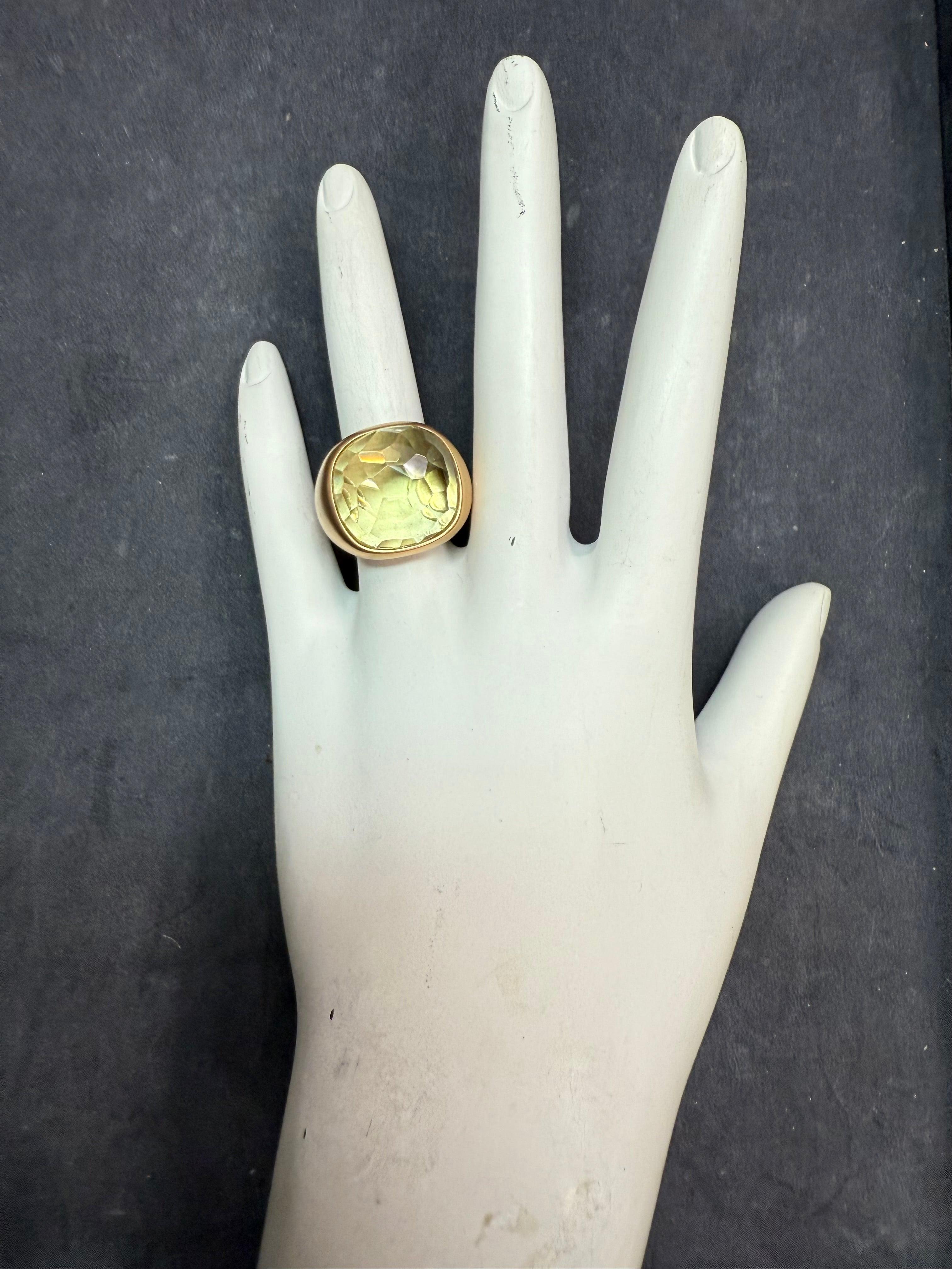 Modern 18K rose gold ring with a luxurious satin finish, crafted in Italy. Set with a striking rose cut greenish quartz measuring approximately 16 mm in length and width. 
The ring measures 18 mm across the top, tapering to 5 mm at the base. Weighs