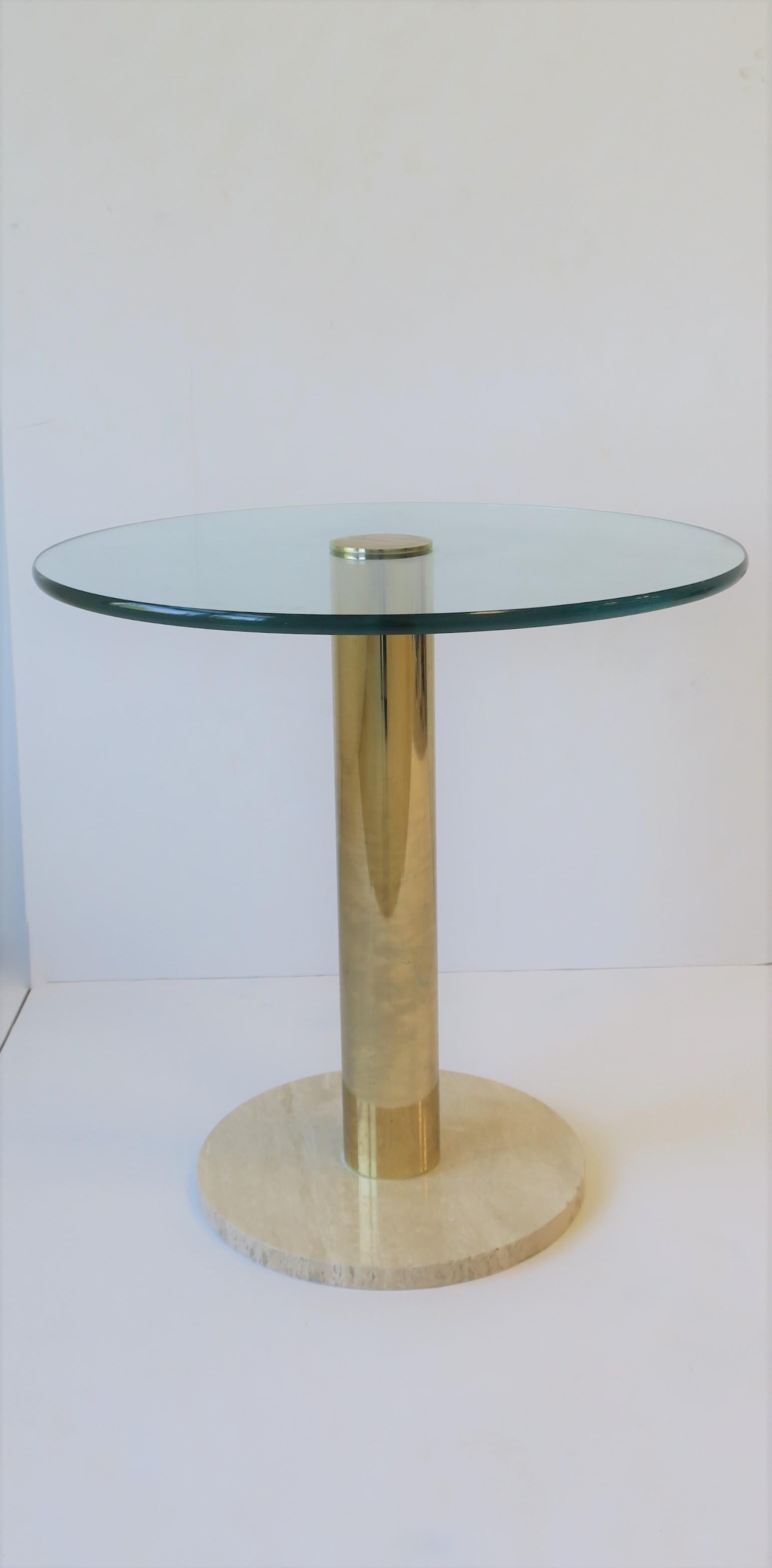 A chic 1970 modern Italian round brass and glass side or drinks table with travertine marble base. Glass top is .50