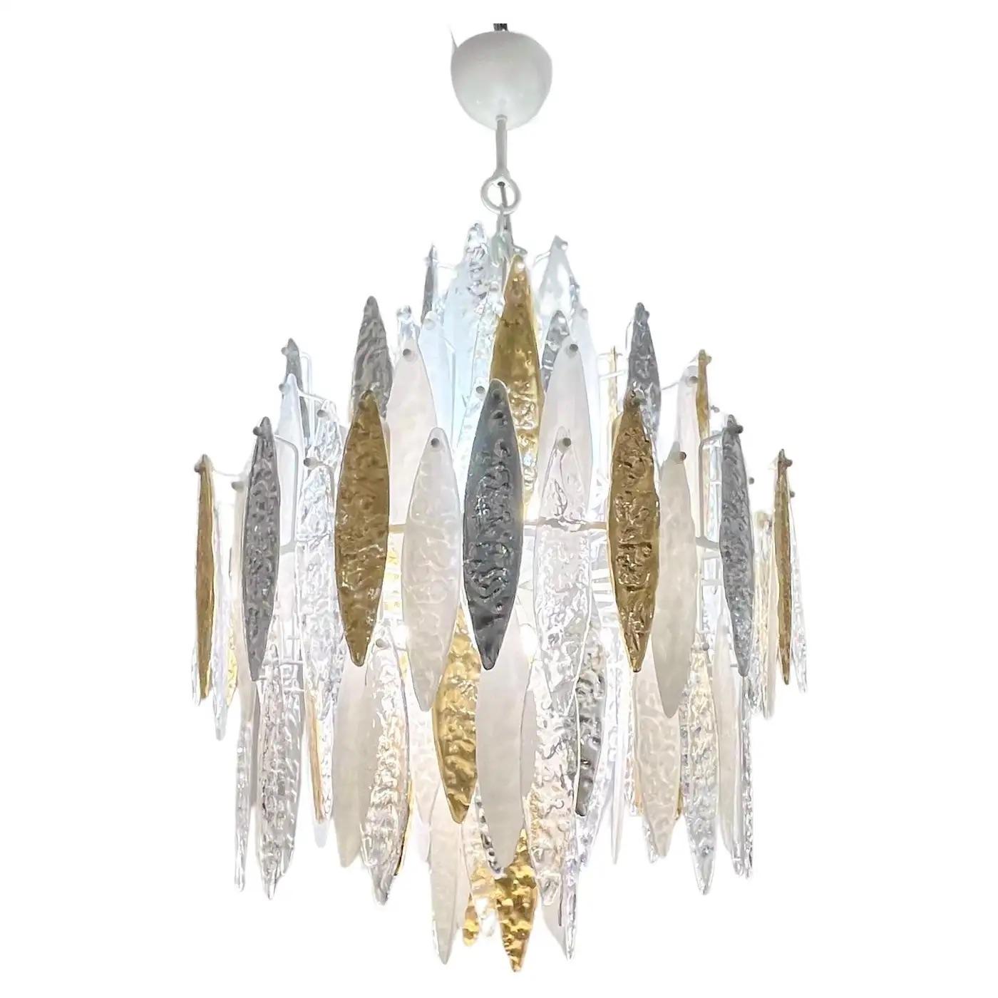 A unique Italian contemporary icicle chandelier, entirely hand made in Italy, the interchangeable different drops in Murano glass are worked with a hammered texture, concave on one side and in relief on the other that creates movement and reflects