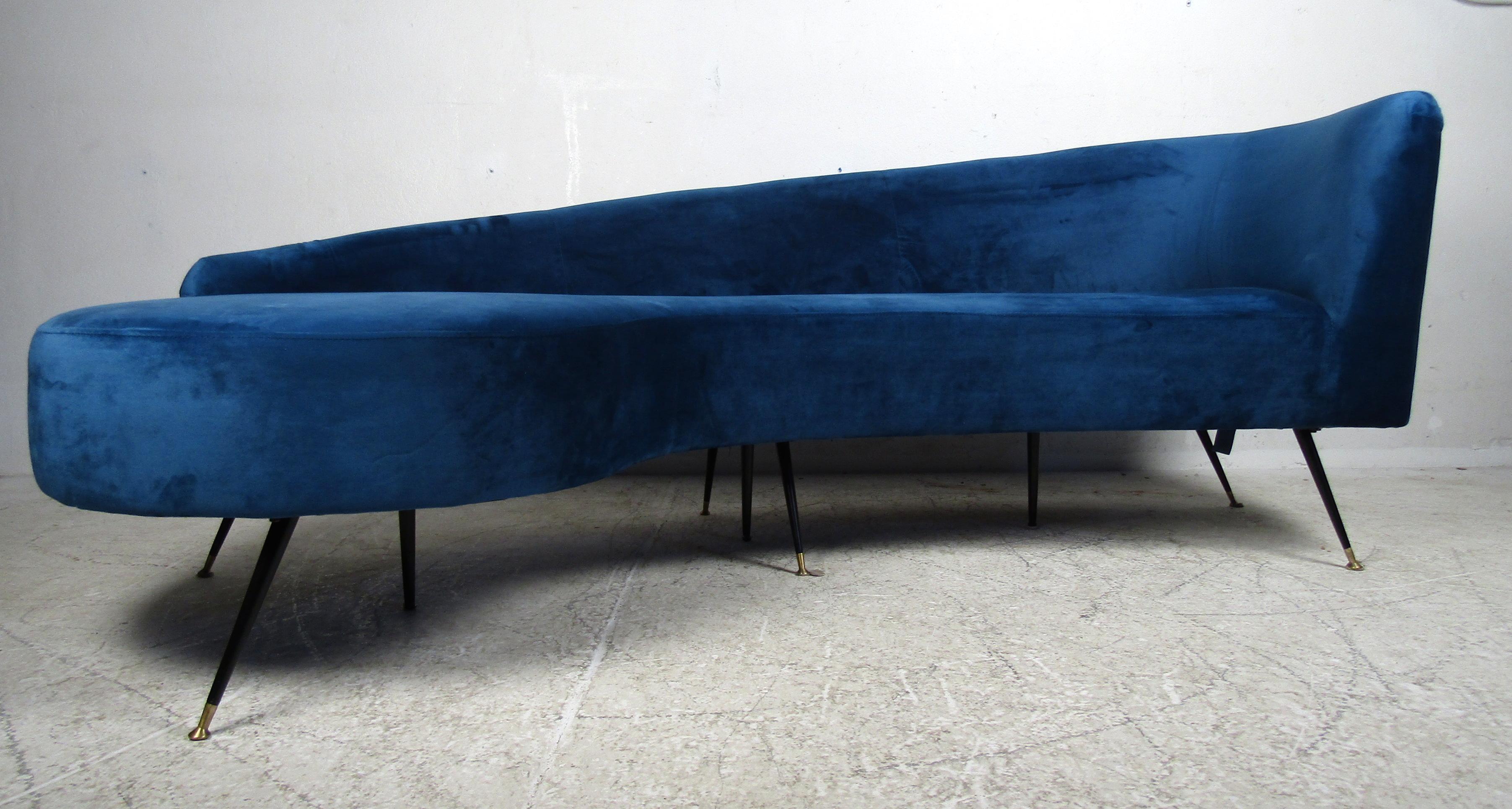 Mid-Century Modern style chaise lounge featured in blue upholstery with black metal legs.

Please confirm the item location (NY or NJ).
    