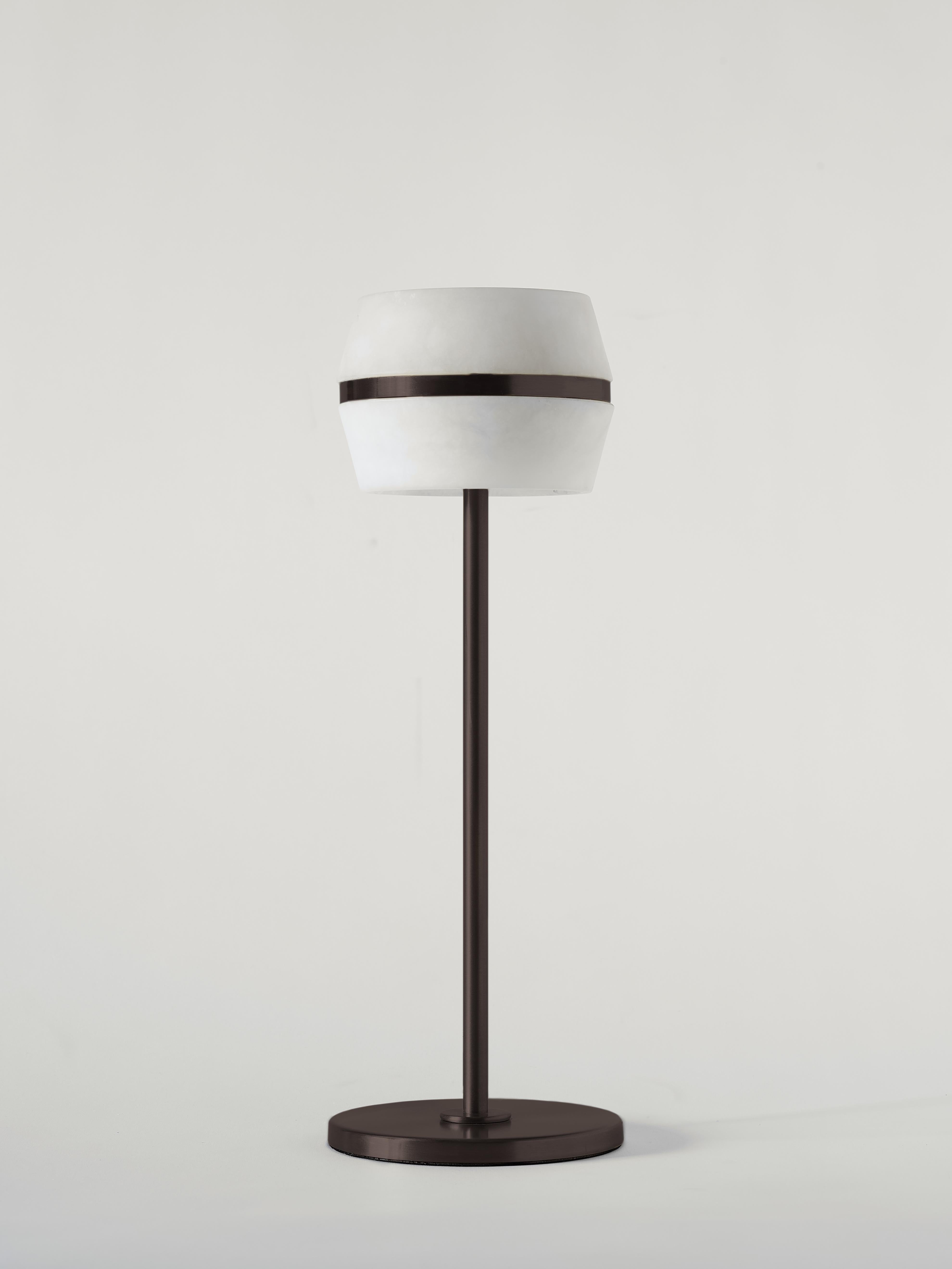 The Tommy wireless table lamp by MATLIGHT Milano is a versatile and functional led light that is designed for use on a table, whether it be in a residential or commercial setting. Its features include a touch sensor and dimmable function, which