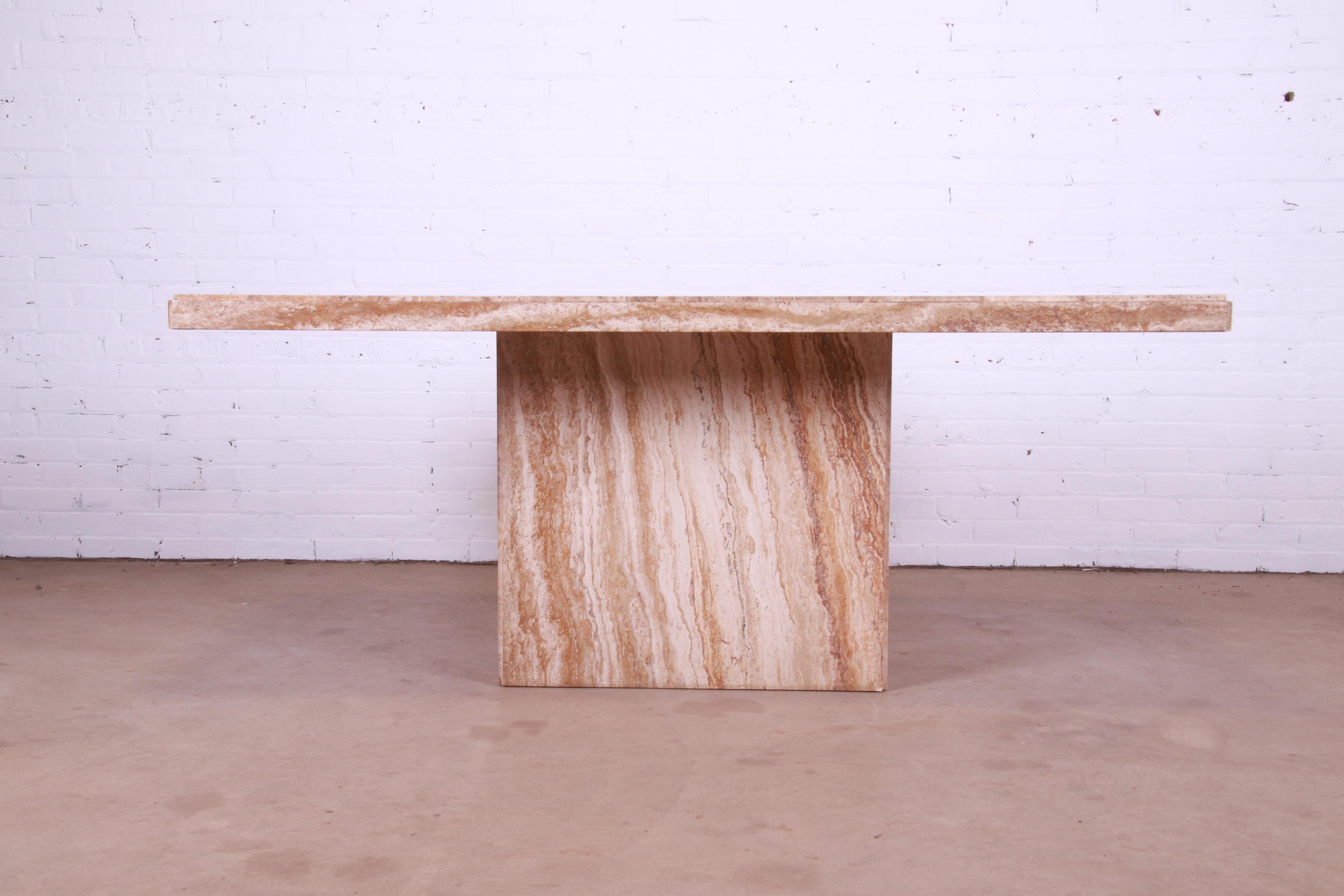 A gorgeous modern Italian travertine marble pedestal dining table

By Lesandre

Italy, Circa 1970s

Measures: 70.75