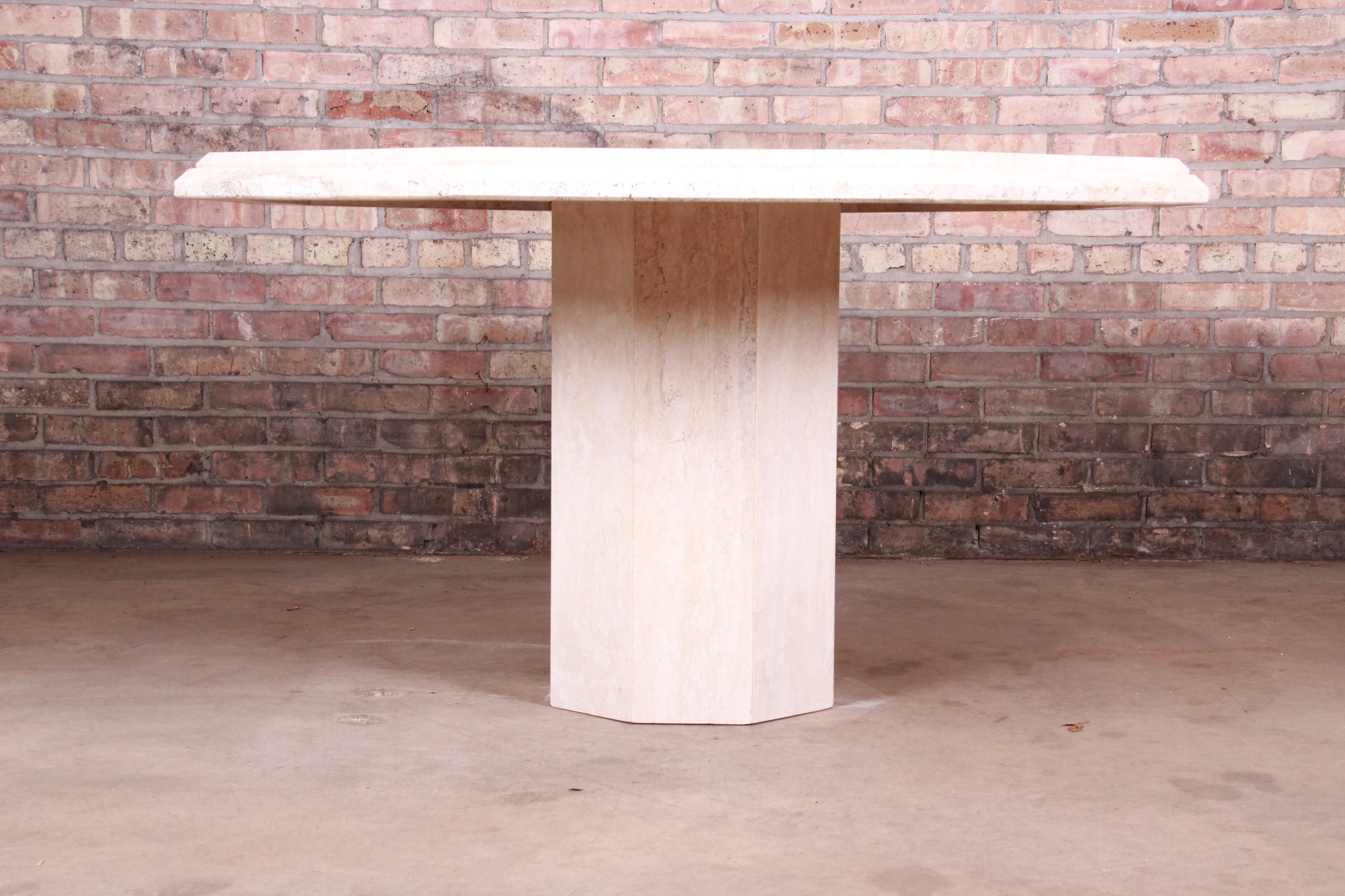An exceptional modern Italian travertine octagonal pedestal dining, game, or center table

Italy, circa 1970s

Measures: 51.25