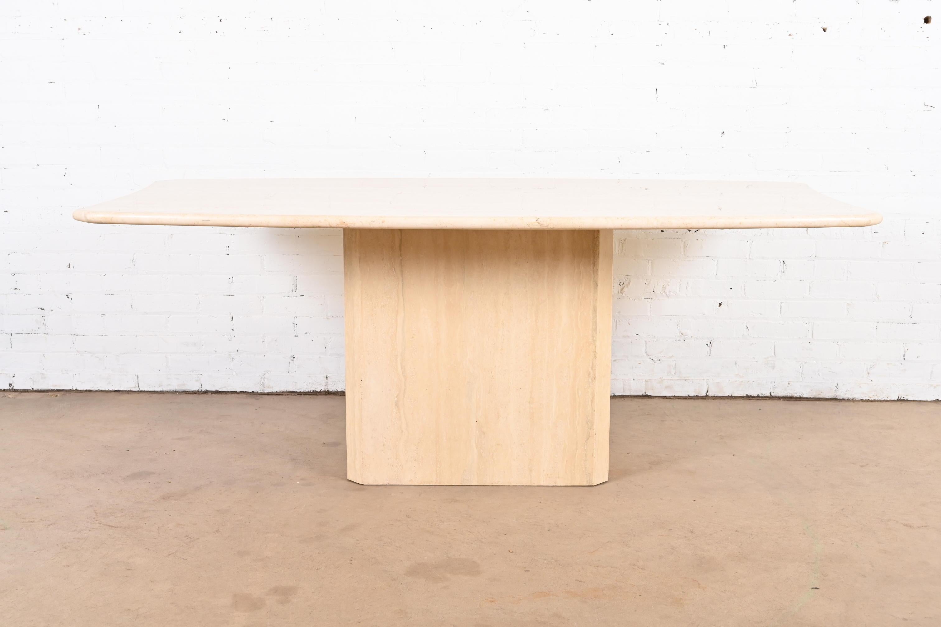 An exceptional Modern Italian travertine pedestal dining table

In the manner of Ello

Italy, Circa 1970s

Measures: 76