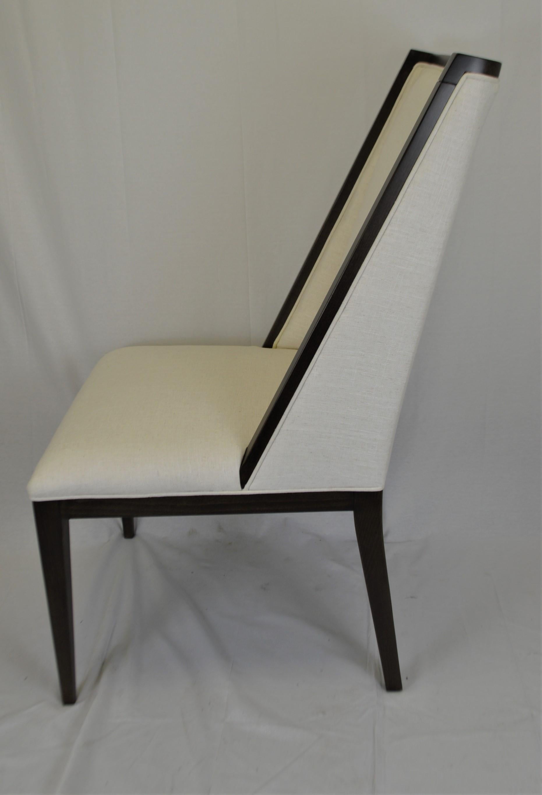 This modern chair is attractive and generous in size. The frame is made in Italy and the frame can be custom finish, it is showing here in a black paint finish.
We offer custom upholstery with your fabric.