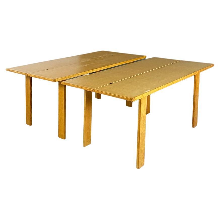 Wooden table which can be split by Gigi Sabadin, 1980s
Dining table made up of two separate tables, each of which is made up of a folding solid wood top and four legs with a rectangular section.
Under the top there is an interlocking structure, a