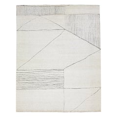 Moderner elfenbeinfarbener Wollteppich im marokkanischen Stil mit abstraktem Motiv von Apadana