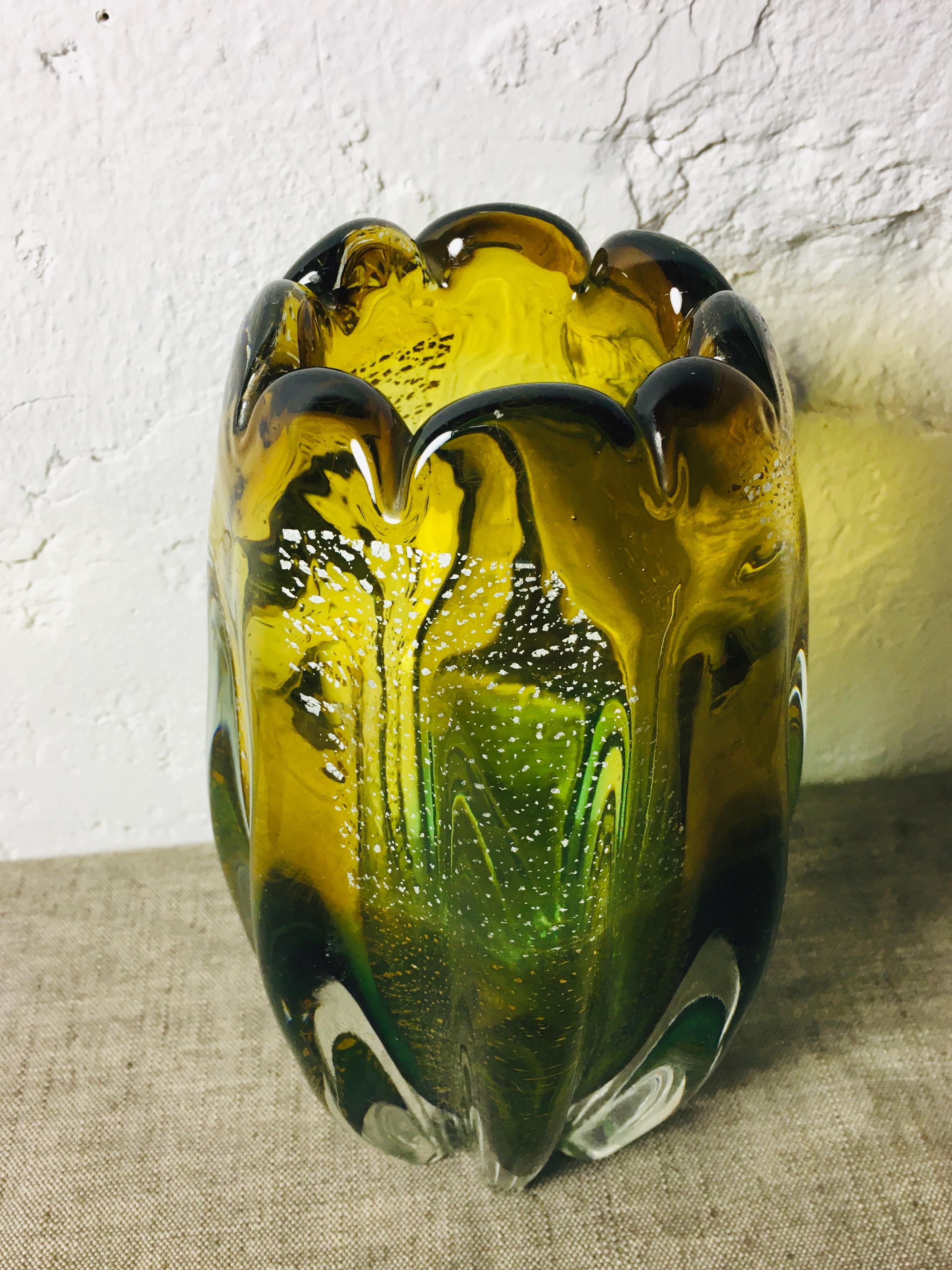 Thick and massive vintage glass vase in amber and green colors with silver foil particles. 1960s - 1970s, beautiful condition.
 