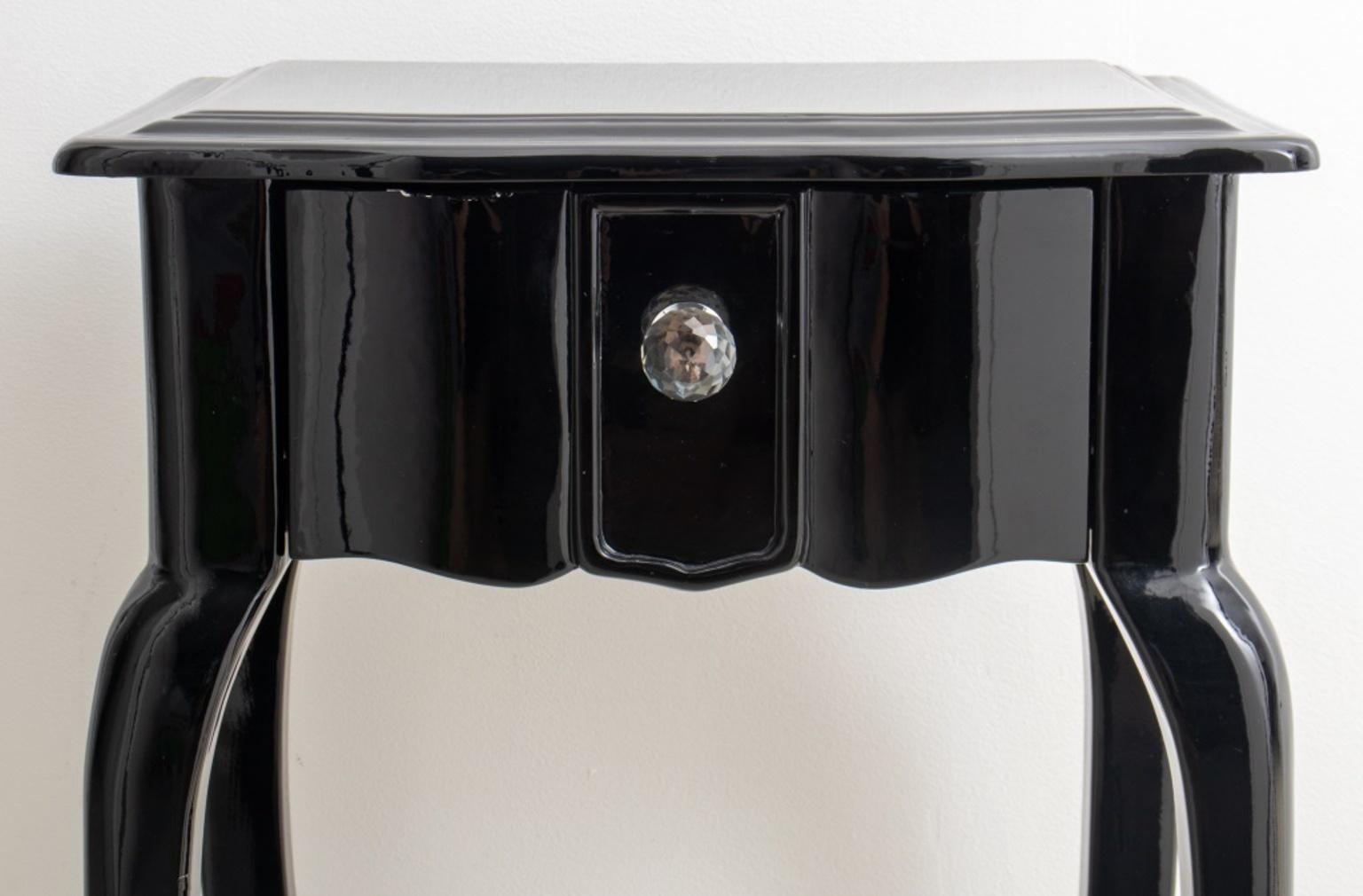 Modern black lacquered wood side or accent table in the Japonisme taste, with one drawer above four cabriole legs, faceted disco ball crystal pull. 30