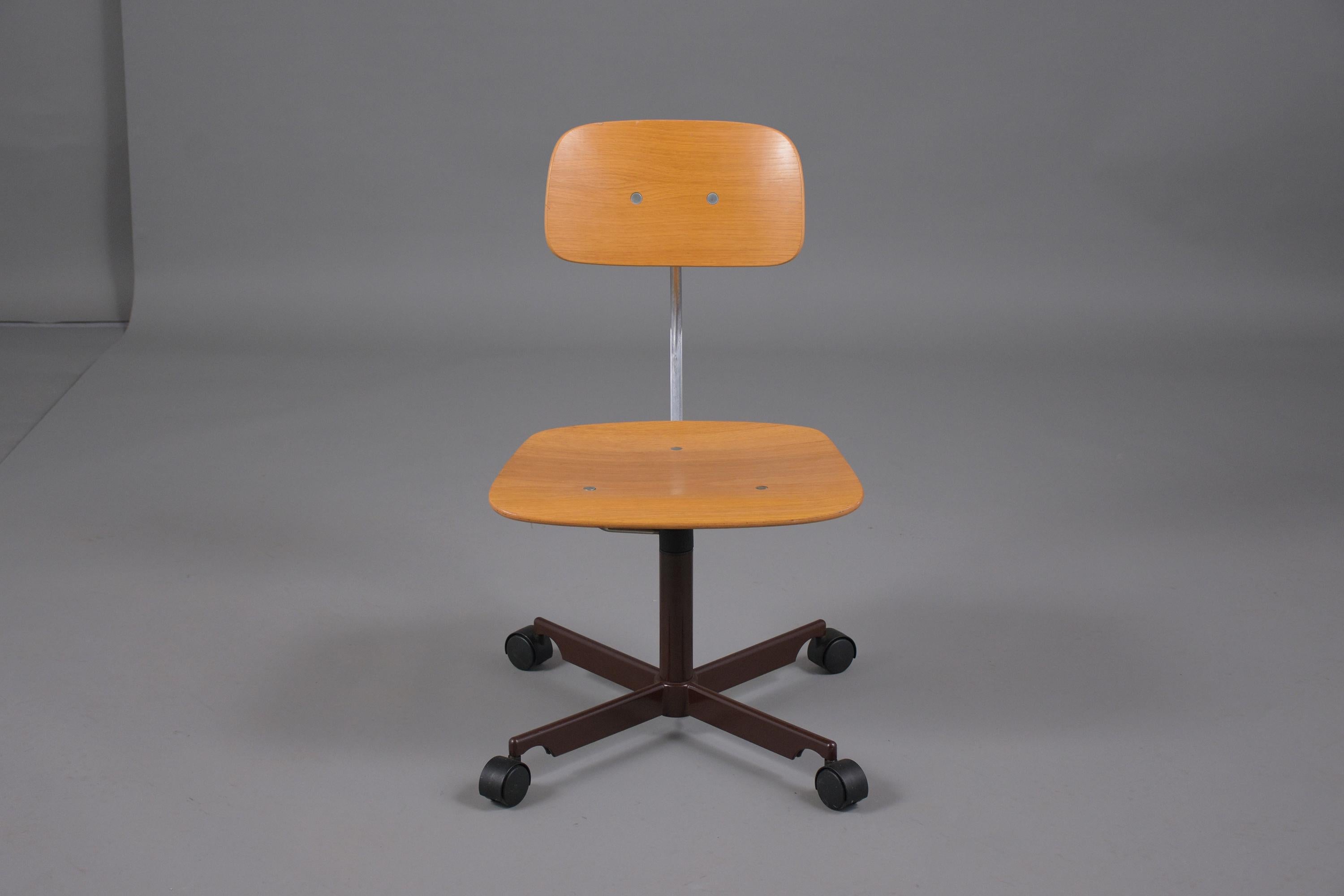 A mid-century Danish Jørgen Rasmussen Kevi office chair crafted out of wood and is in great condition newly restored by our craftsmen.  The chair has just been waxed and polished keeping the beautiful patina finish and features a swivel base with