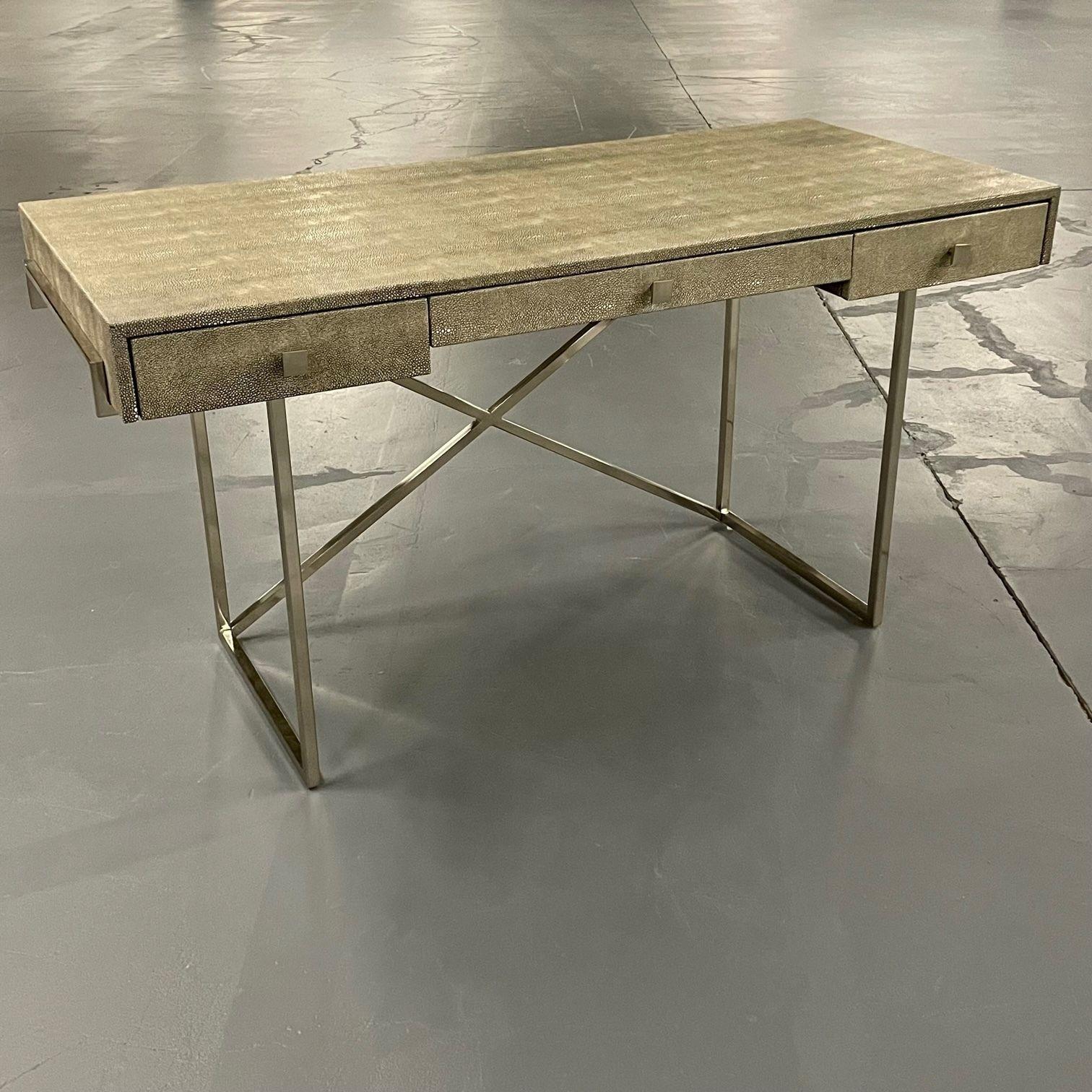 Modern Karl Springer style three-drawer faux Shagreen desk on a chrome plated x form base.
Sleek desk or writing table in a Springer style finish with a chrome X form base leading to a finely detailed table top.