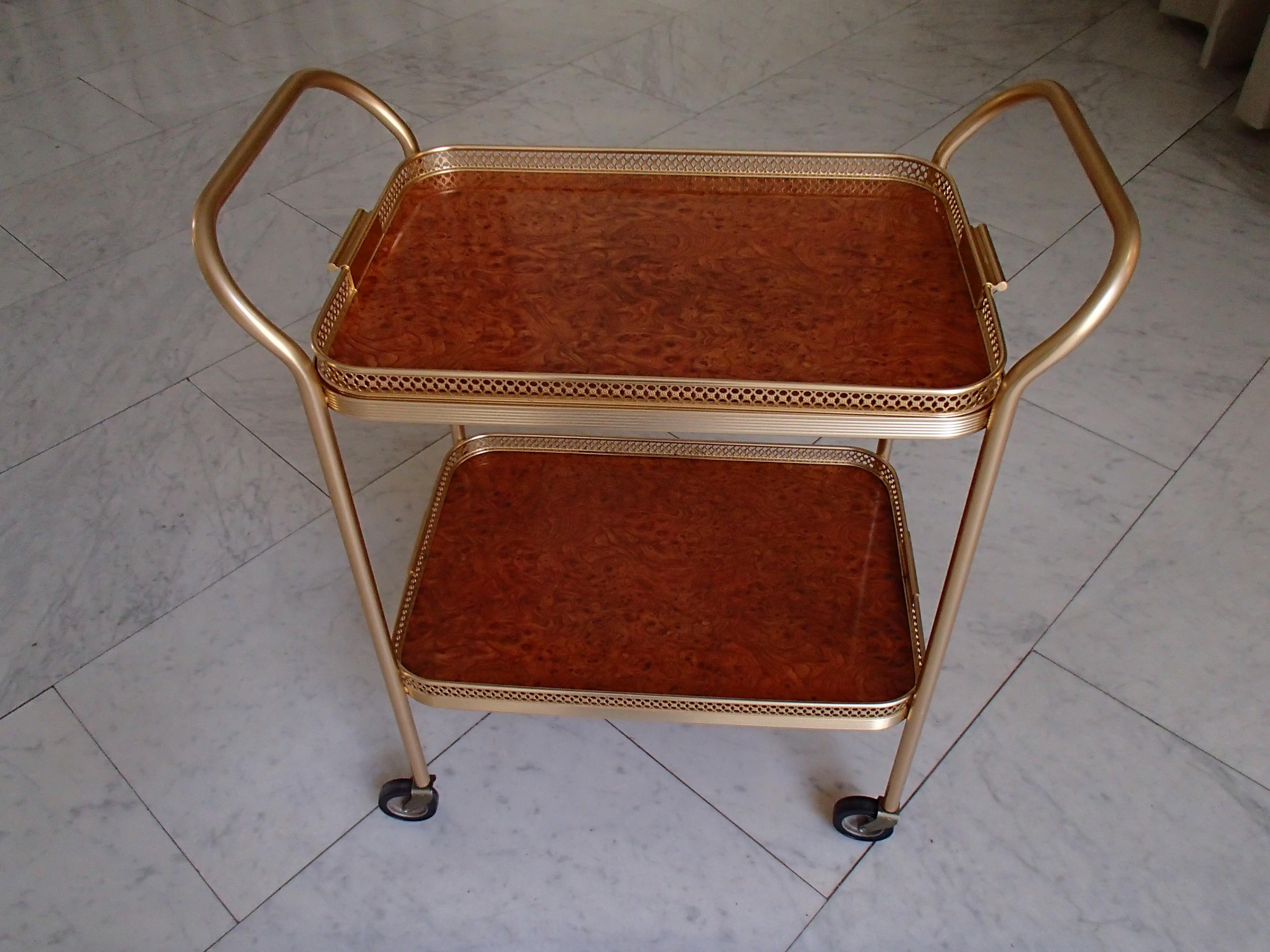 Mid-Century Modern Kaymet bar cart with maple eye and decorative edges.