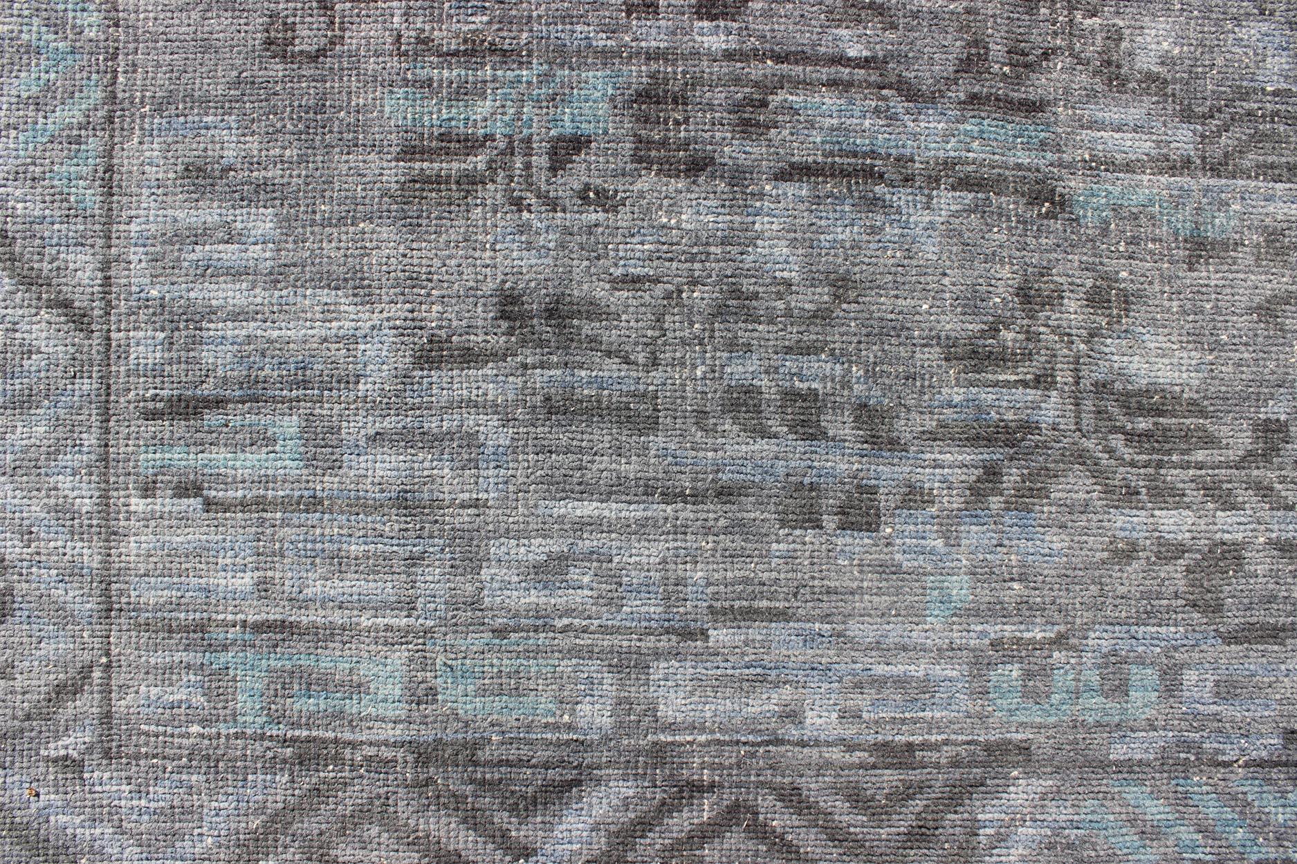 Contemporary Modern Khotan with Medallion Design in Warm Gray, Brown, Blue and Charcoal For Sale