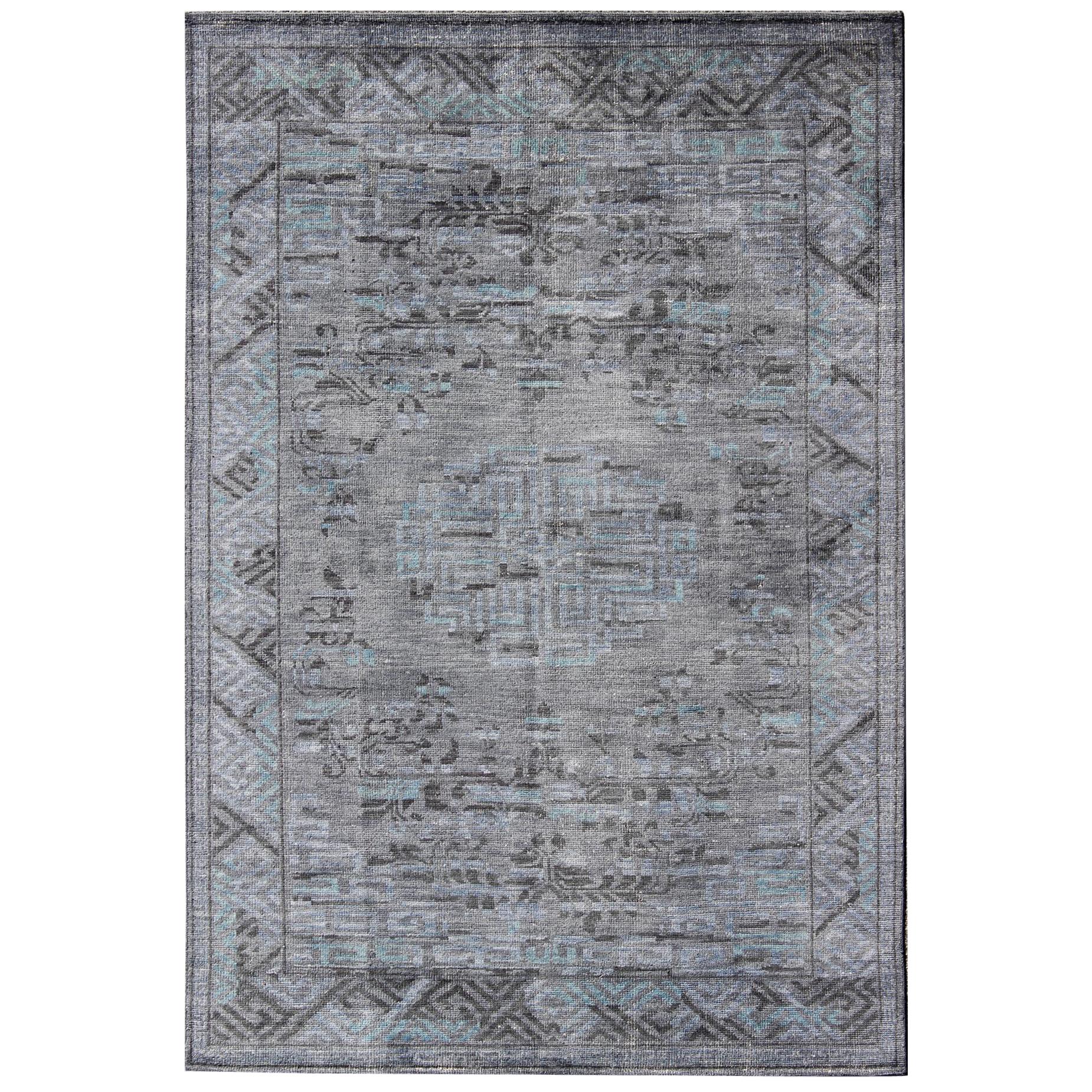 Modern Khotan with Medallion Design in Warm Gray, Brown, Blue and Charcoal For Sale
