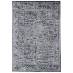 Modern Khotan with Medallion Design in Warm Gray, Brown, Blue and Charcoal