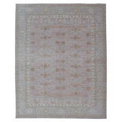 Modern Khotan Rug in Faded Rose and Soft Beige with Pale Blue and Gold Accents Modern Khotan Rug in Faded Rose and Soft Beige with Pale Blue and Gold Accents