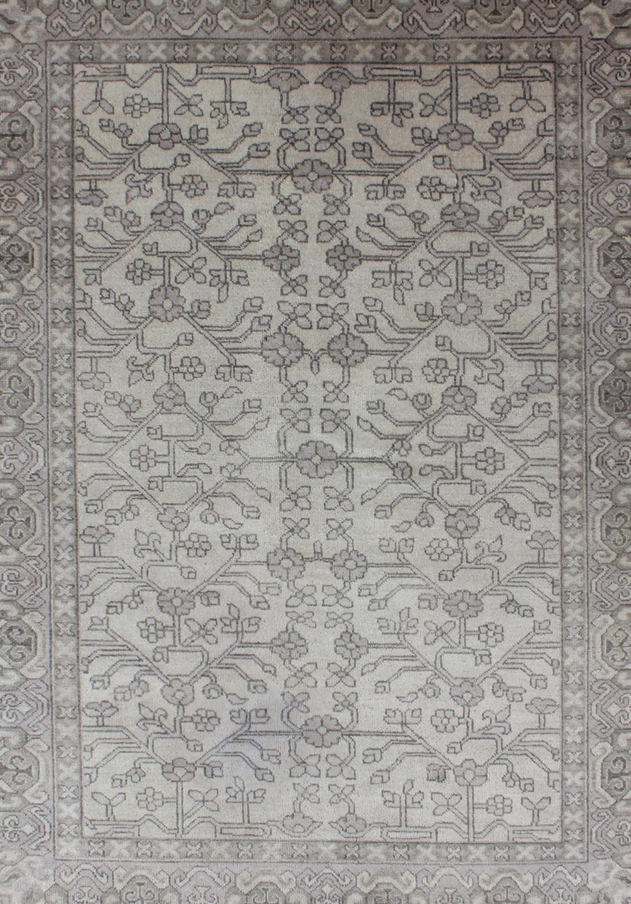 Modern Hand-Knotted Khotan Rug in Wool with All-Over Design in Cream, Gray and Taupe.

Measures: 5'6 x 8'6. 

This modern Indian Khotan rug has been hand-knotted in wool and features an all-over sub-geometric design rendered in cream, gray and taupe