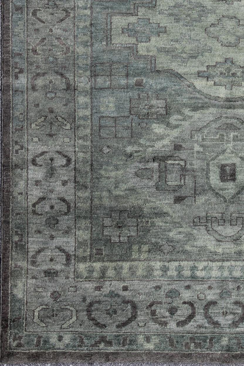 Large Modern Khotan rug, Keivan Woven Arts / rug OB-103434802-0623017, country of origin / type: India / Khotan, circa early-21st Century. Contemporary Khotan Rug.

This hand-knotted Khotan rug features a tri-medallion modern and transitional design