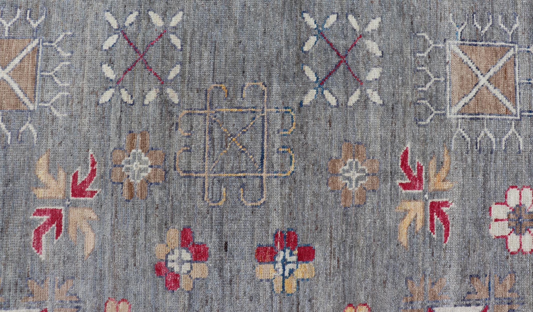 Modern Khotan Rug with Circular Medallions in Shades of Gray, Red, and Brown. Keivan Woven Arts / rug AFG-67300 / country of origin / type: Afghanistan / Khotan. 
Measures: 9'6 x 11'9 
This modern Khotan made rug features Samarkand design with