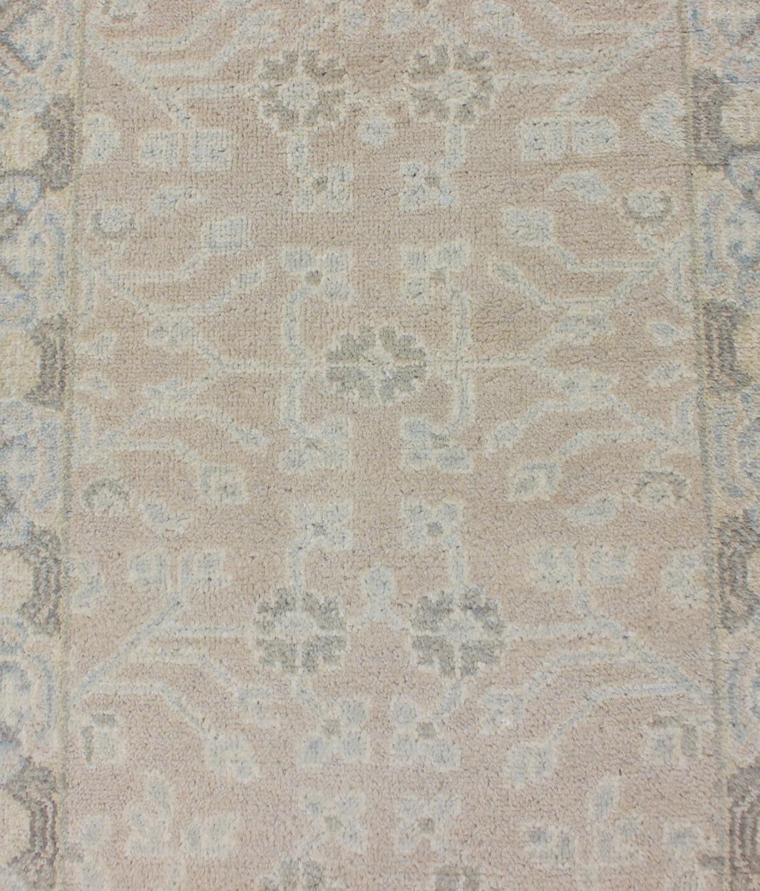 Keivan Woven Arts Khotan Runner in Wool with All-Over Sub-Geometric Design

Measures: 2'6 x 8'0

This modern Indian Khotan rug has been hand-knotted in wool and features an all-over, sub-geometric floral design rendered in blue and neutral tones. A